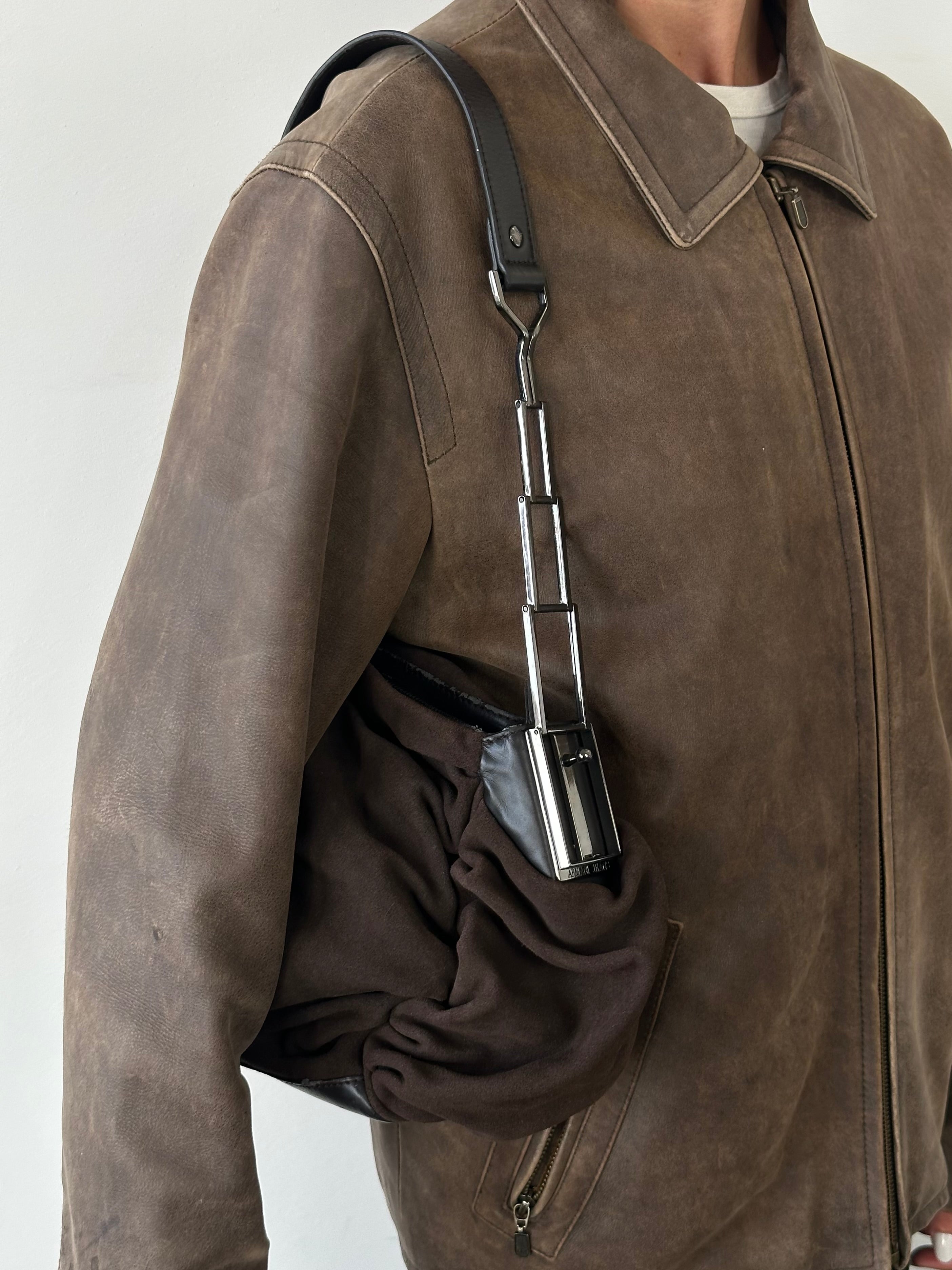 Armani Jeans suede ruched shoulder bag with a stylish design, featuring a soft texture and elegant detailing.