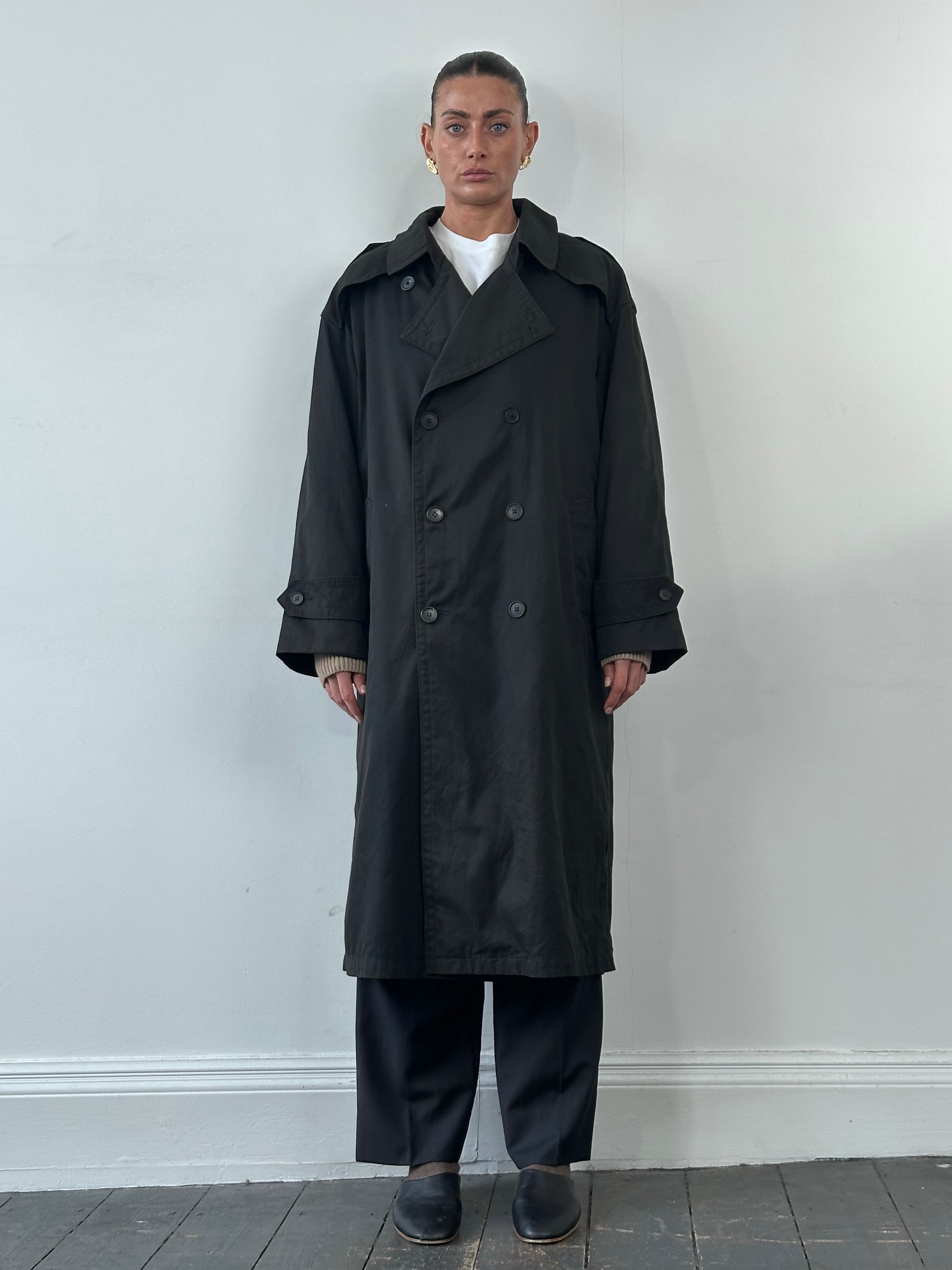 Christian Dior Monsieur double-breasted trench coat in XL, shown hanging with classic beige fabric and button details.