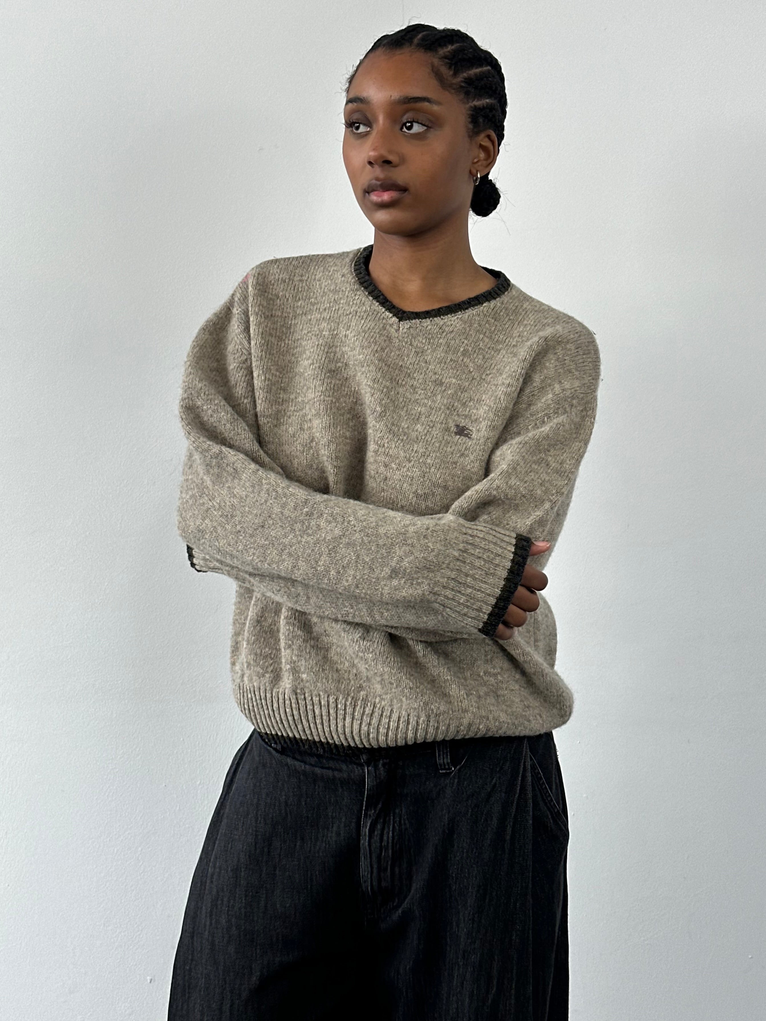 Burberry London 2000s merino wool v-neck knitted jumper in size M/L, featuring a classic beige color and textured knit pattern.