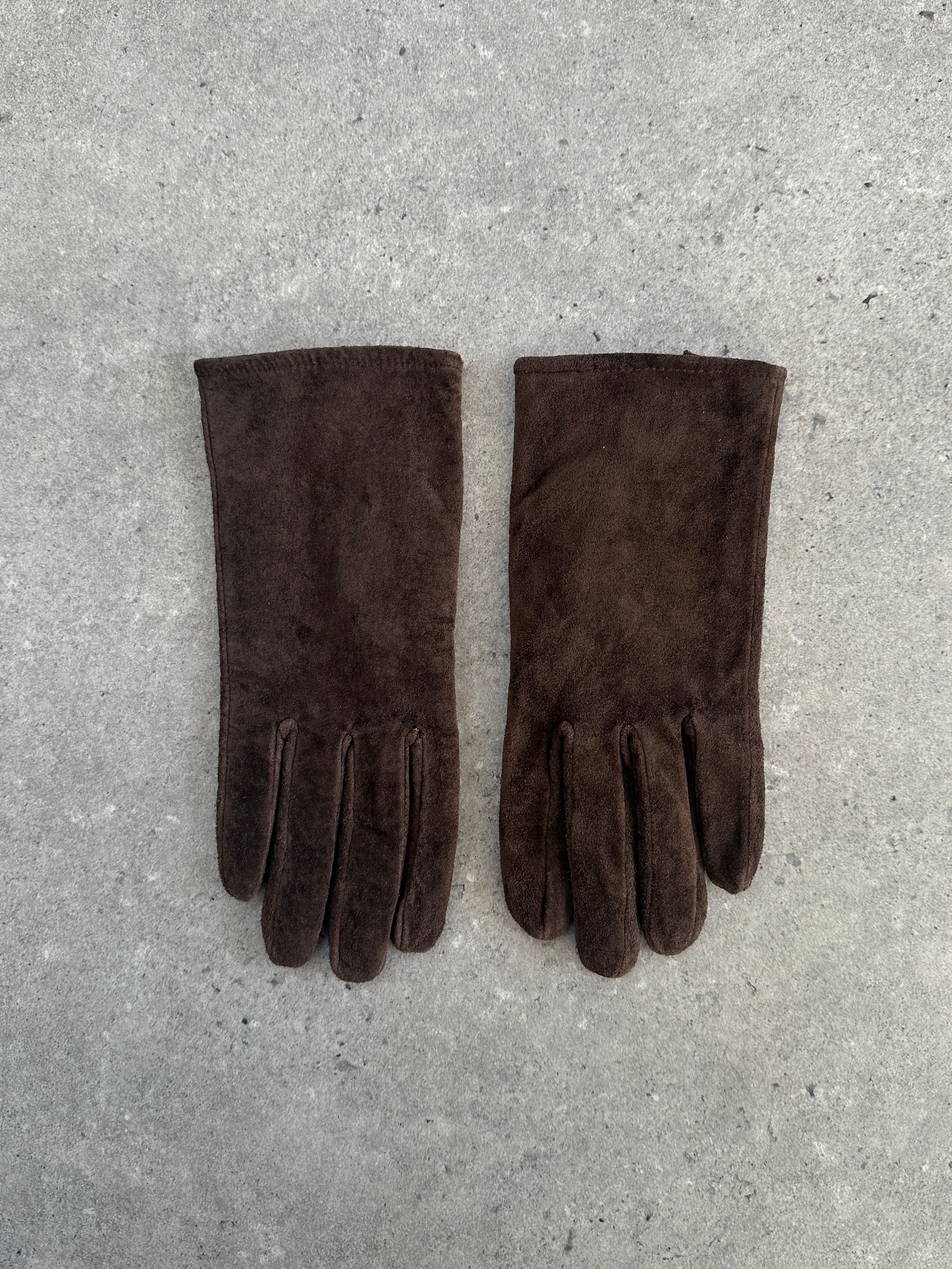 Vintage brand vintage suede gloves in size small, showing soft brown leather with stitching details and a classic fit.