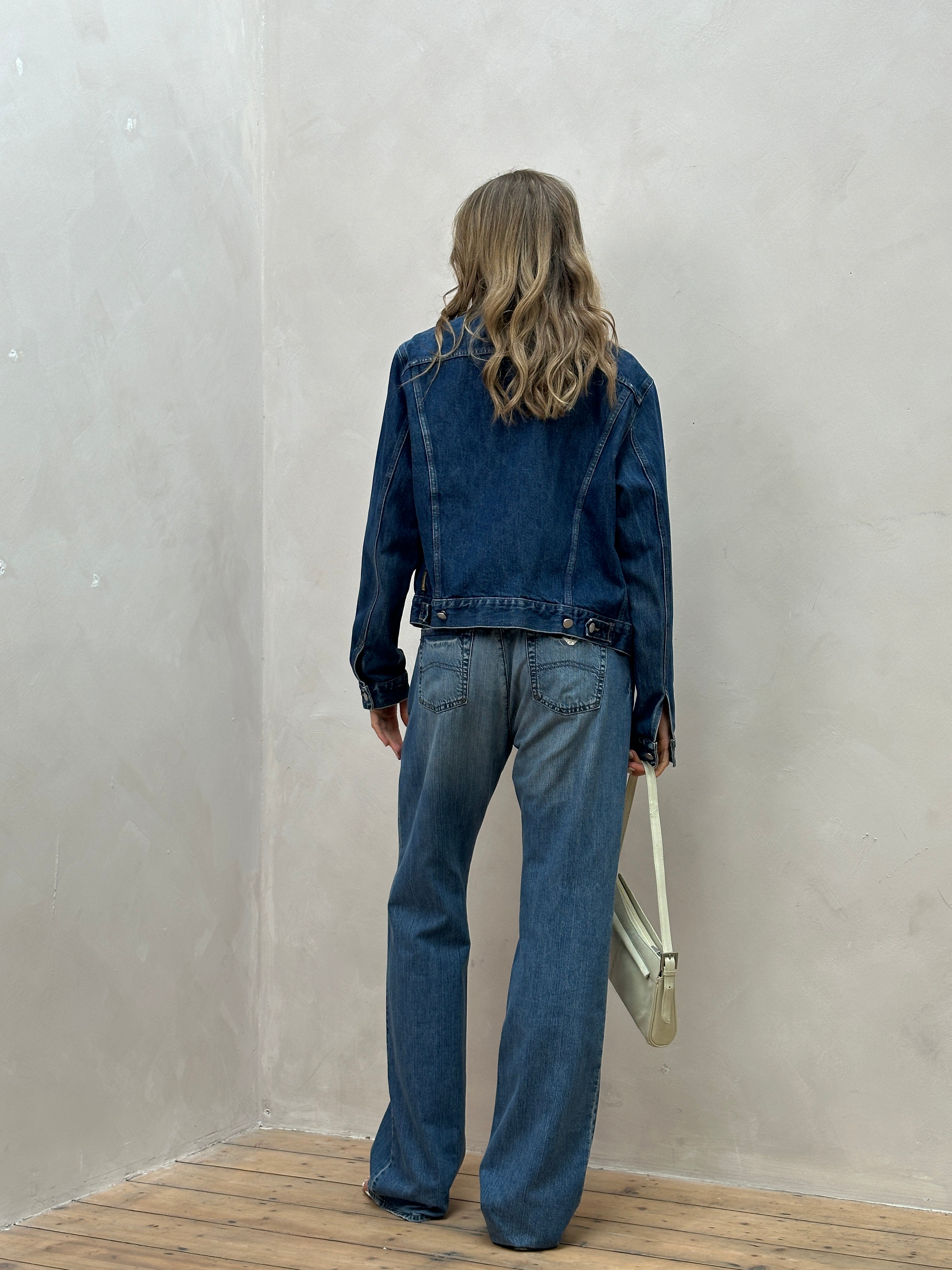 Armani Jeans stonewashed mid-waist denim jeans in size W34 displayed on a mannequin. Blue, casual fit, classic five-pocket style.