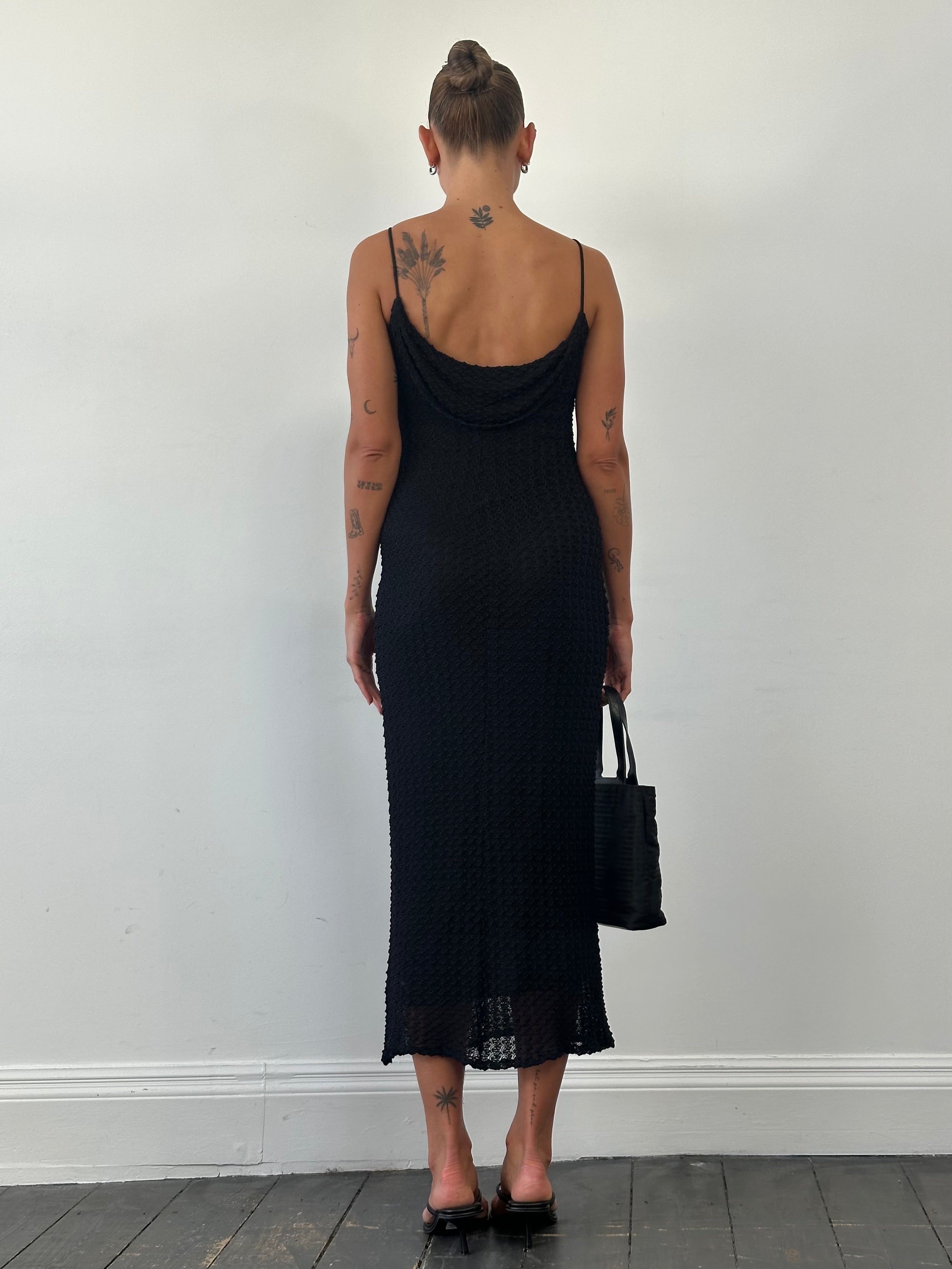 American Vintage textured maxi dress in size small, flowing design with a soft, textured fabric and elegant silhouette.