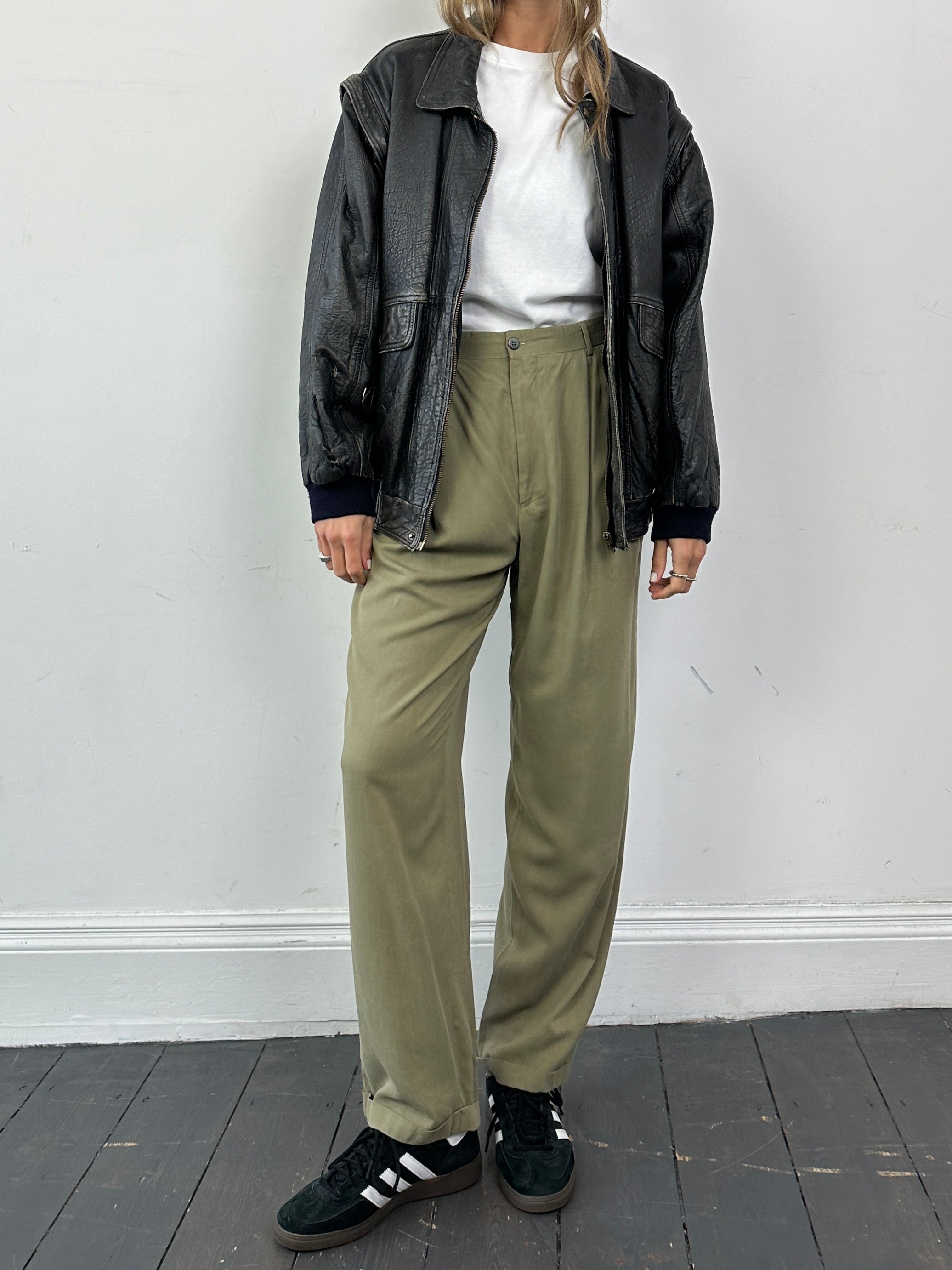 Versace Versus silk high-waisted straight-leg trousers in black, front view showing tailored fit and elegant design.