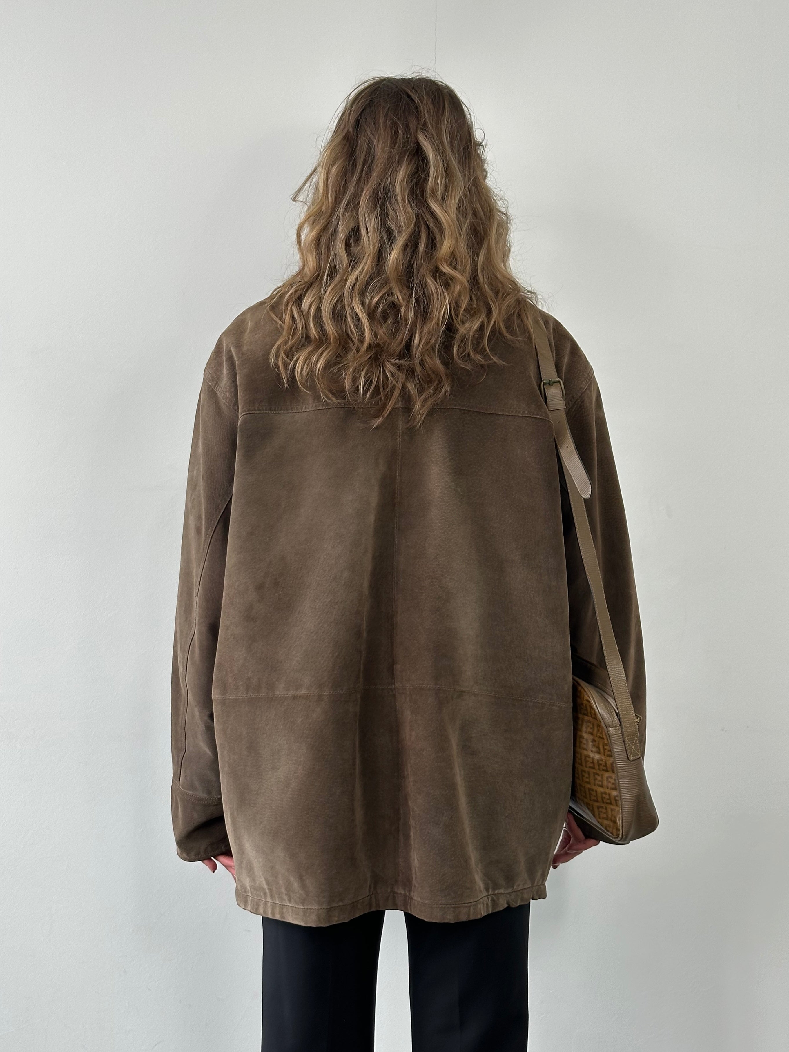 Vintage leather suede jacket in XL/XXL size, featuring classic design and soft texture, displayed on a hanger.