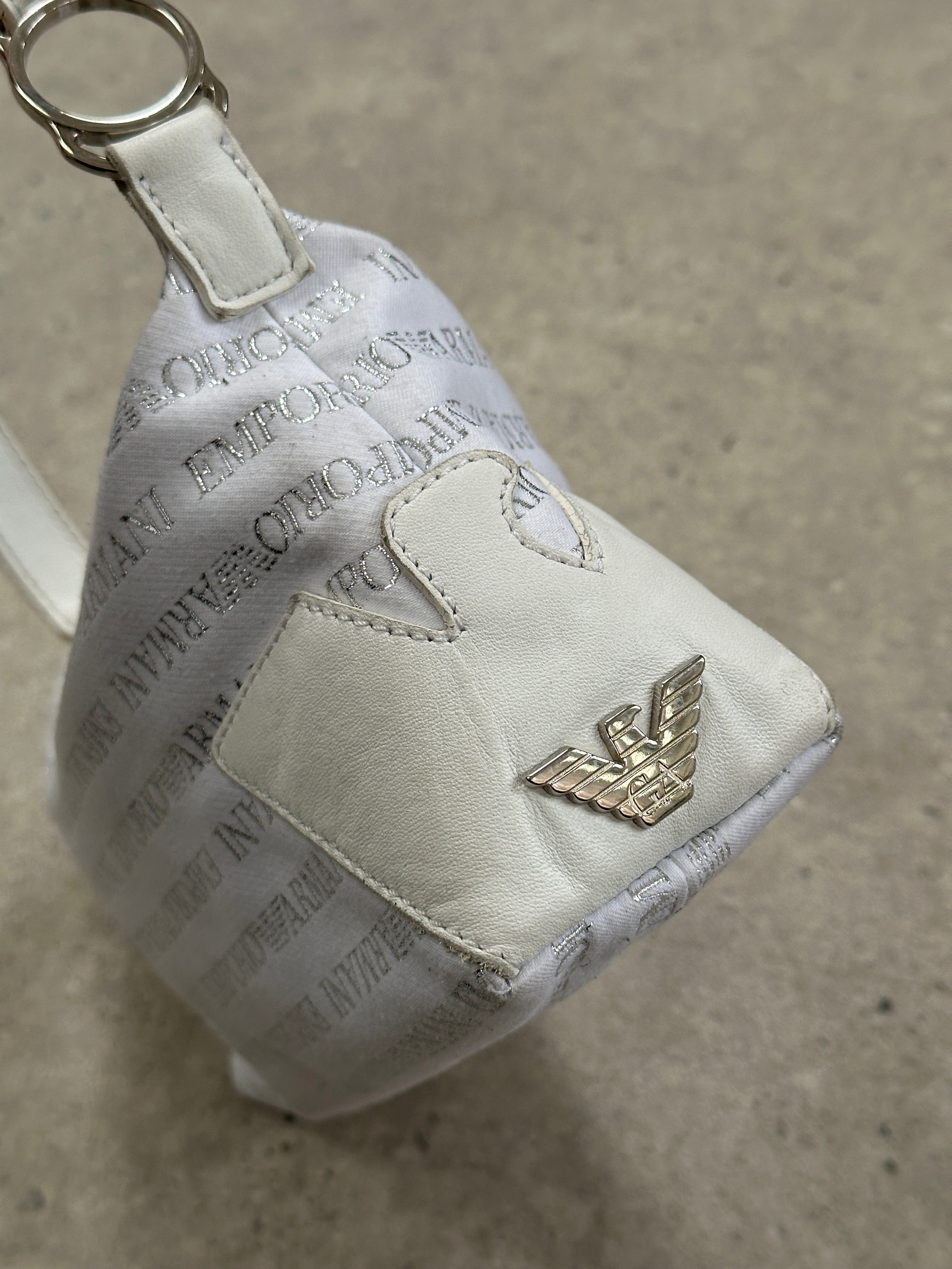 Emporio Armani Monogram Shoulder Bag featuring the brand's signature logo pattern and a sleek, stylish design.