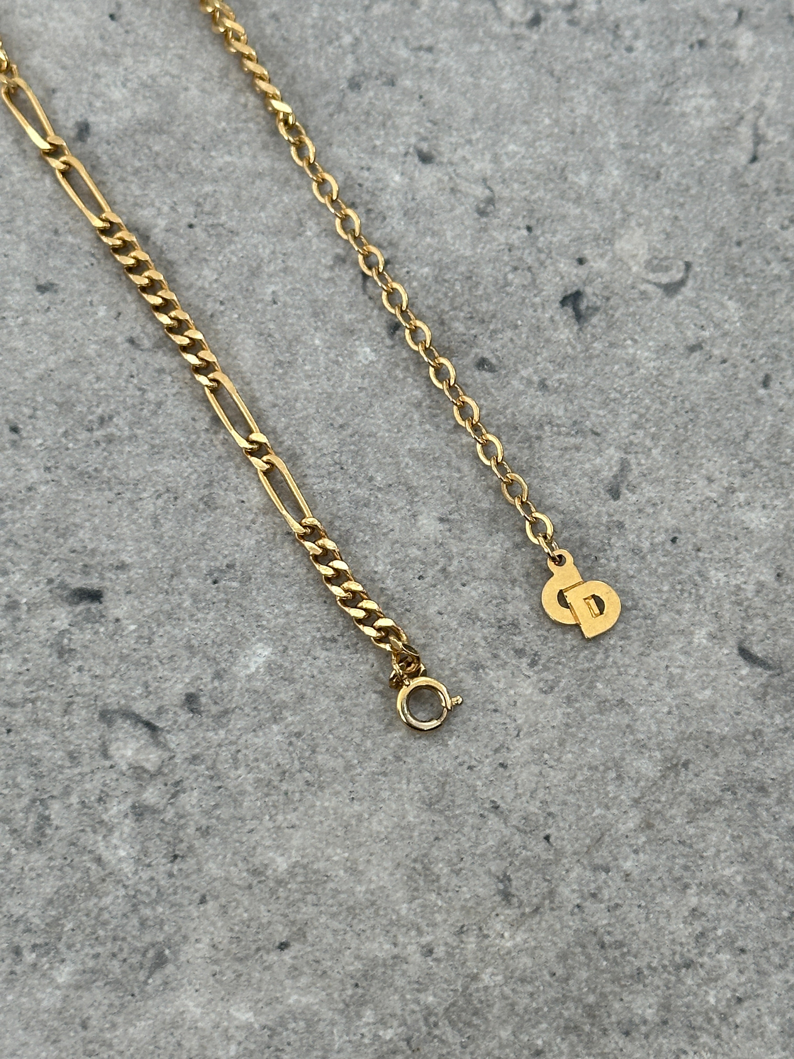 Christian Dior 18-inch gold-plated logo pendant necklace showing a sleek chain and the iconic Dior logo pendant.