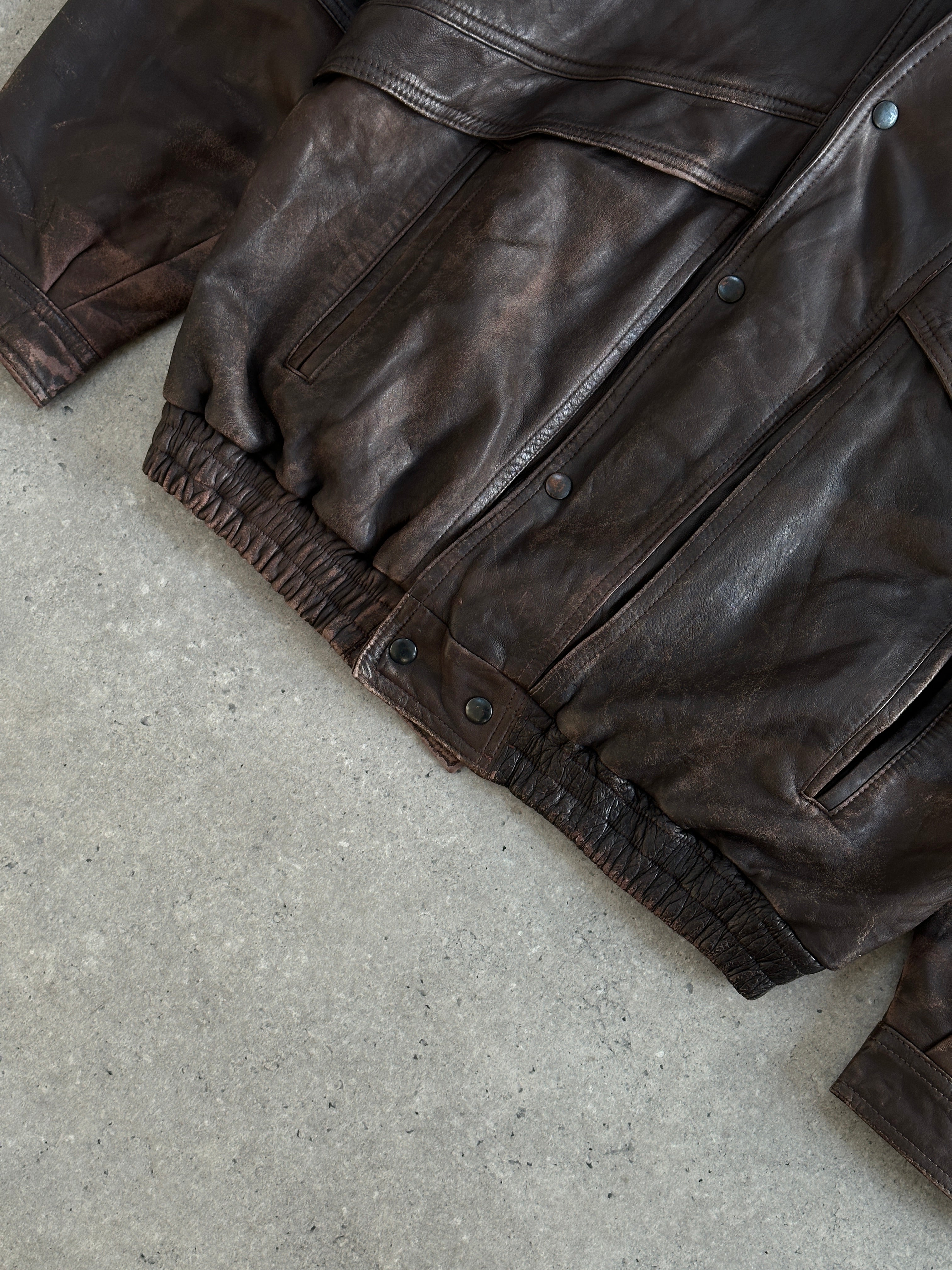 Vintage 1990s aged double collar leather bomber jacket in XL, featuring distressed leather and classic bomber style.