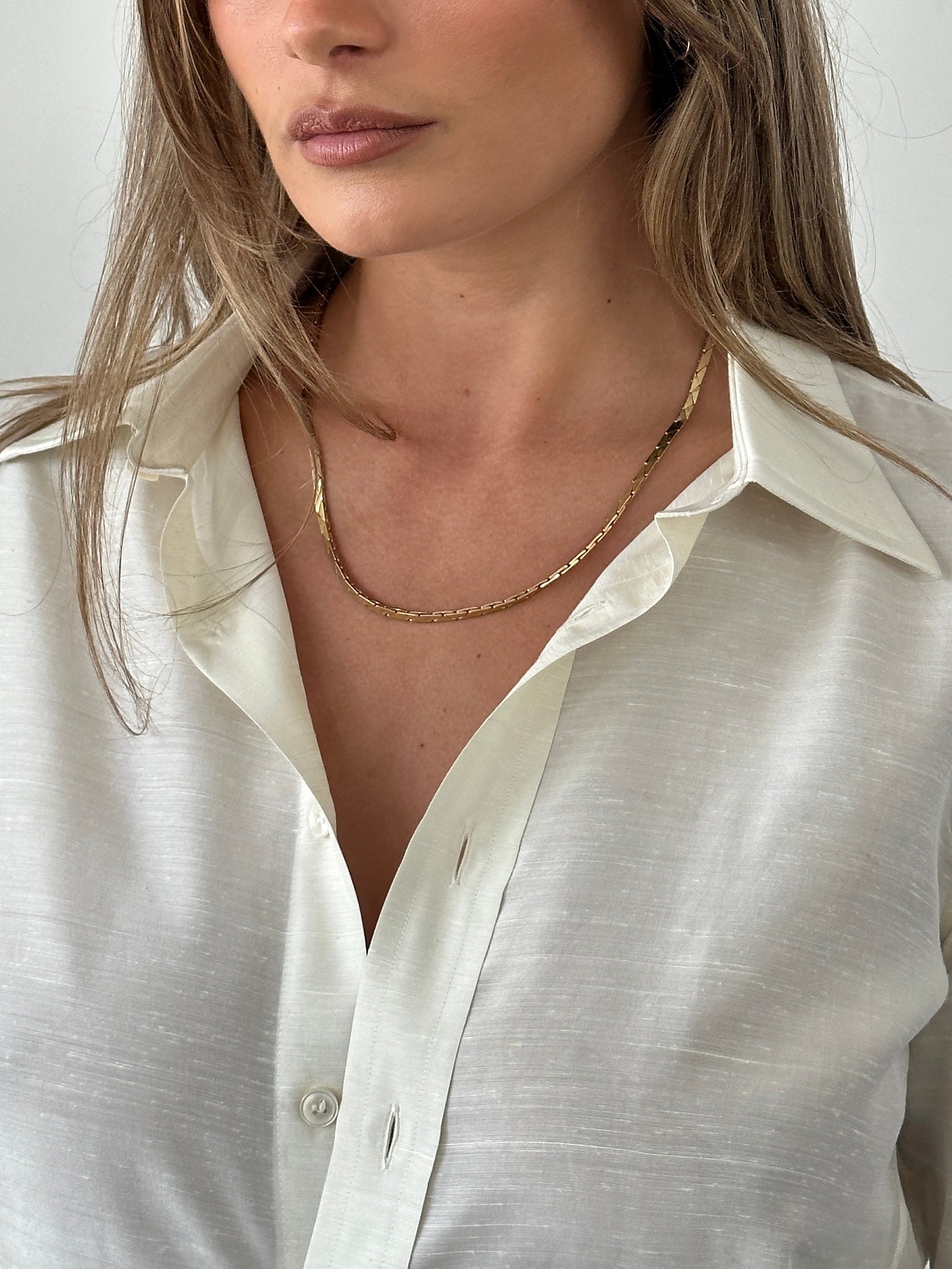 Gold plated Pierre Cardin necklace featuring a delicate chain and elegant pendant for stylish everyday wear.