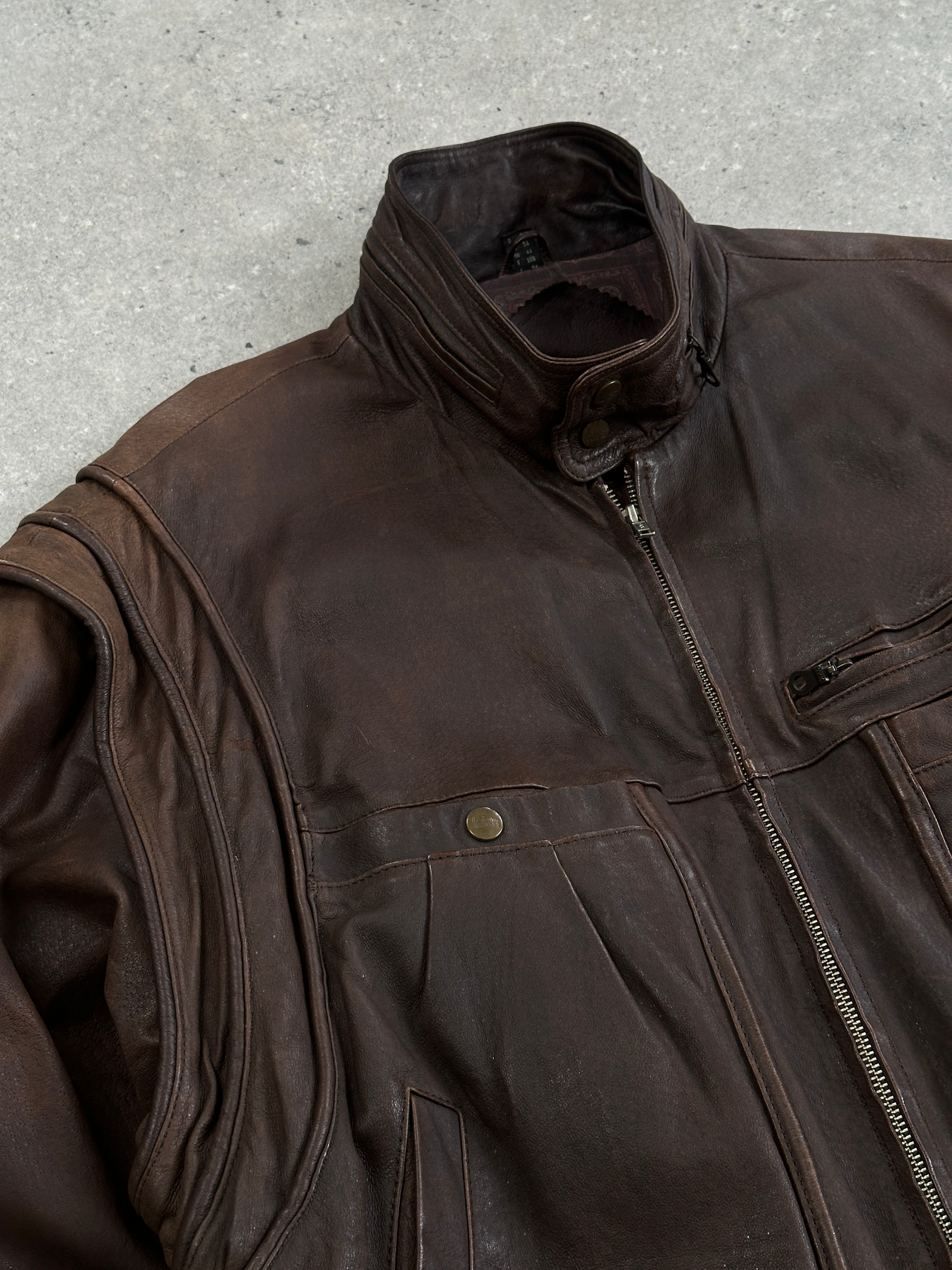 Vintage high neck aged leather bomber jacket in size L/XL, featuring a rugged, distressed leather finish and classic bomber style.
