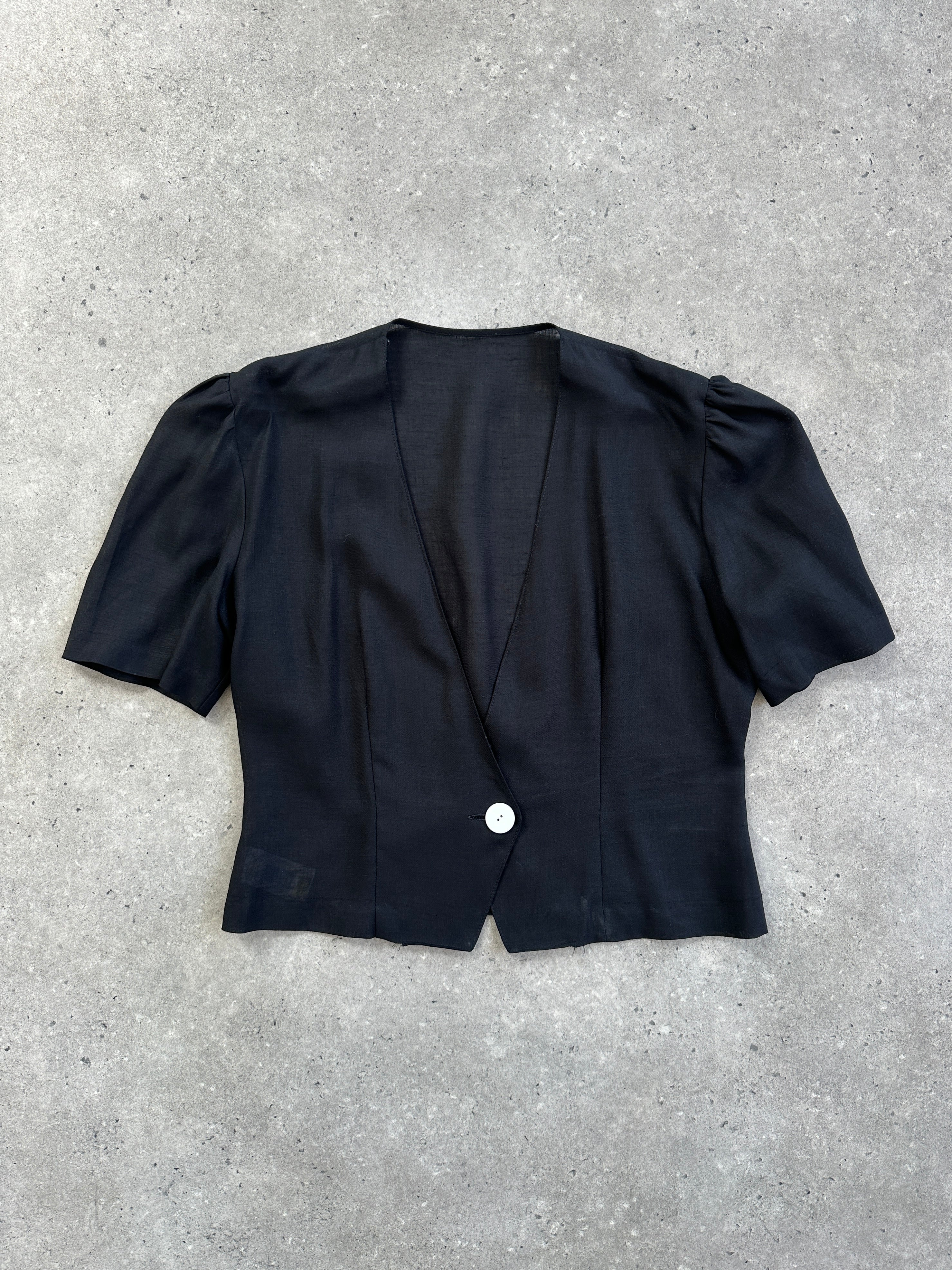 St Michael 1987 cropped short sleeve blazer in black, tailored fit with lapel collar and button closure, displayed on a hanger.