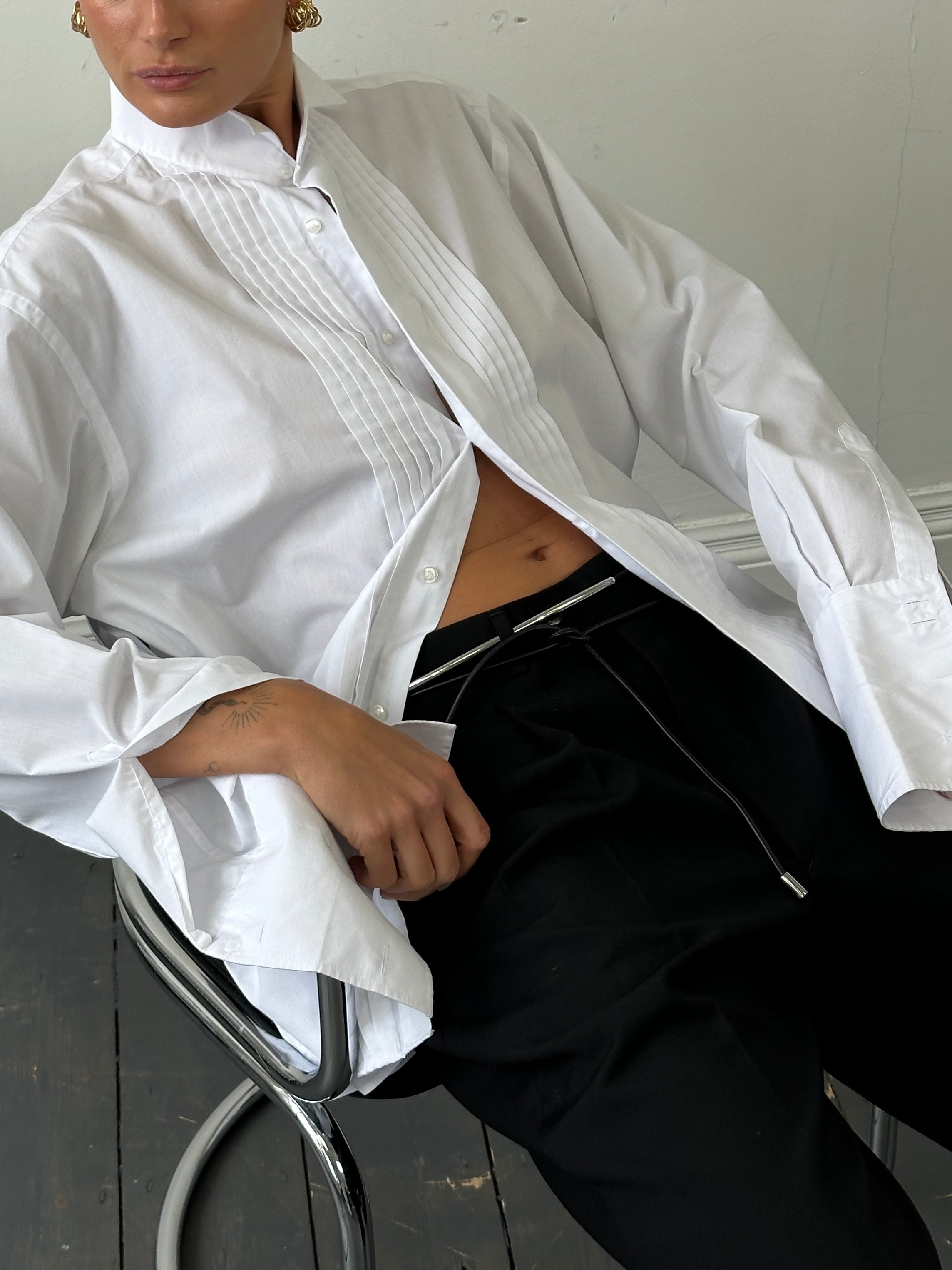 Vintage brand vintage tuxedo wing collar dress shirt in size L/XL, showing a classic white shirt with wing collar and front button details.