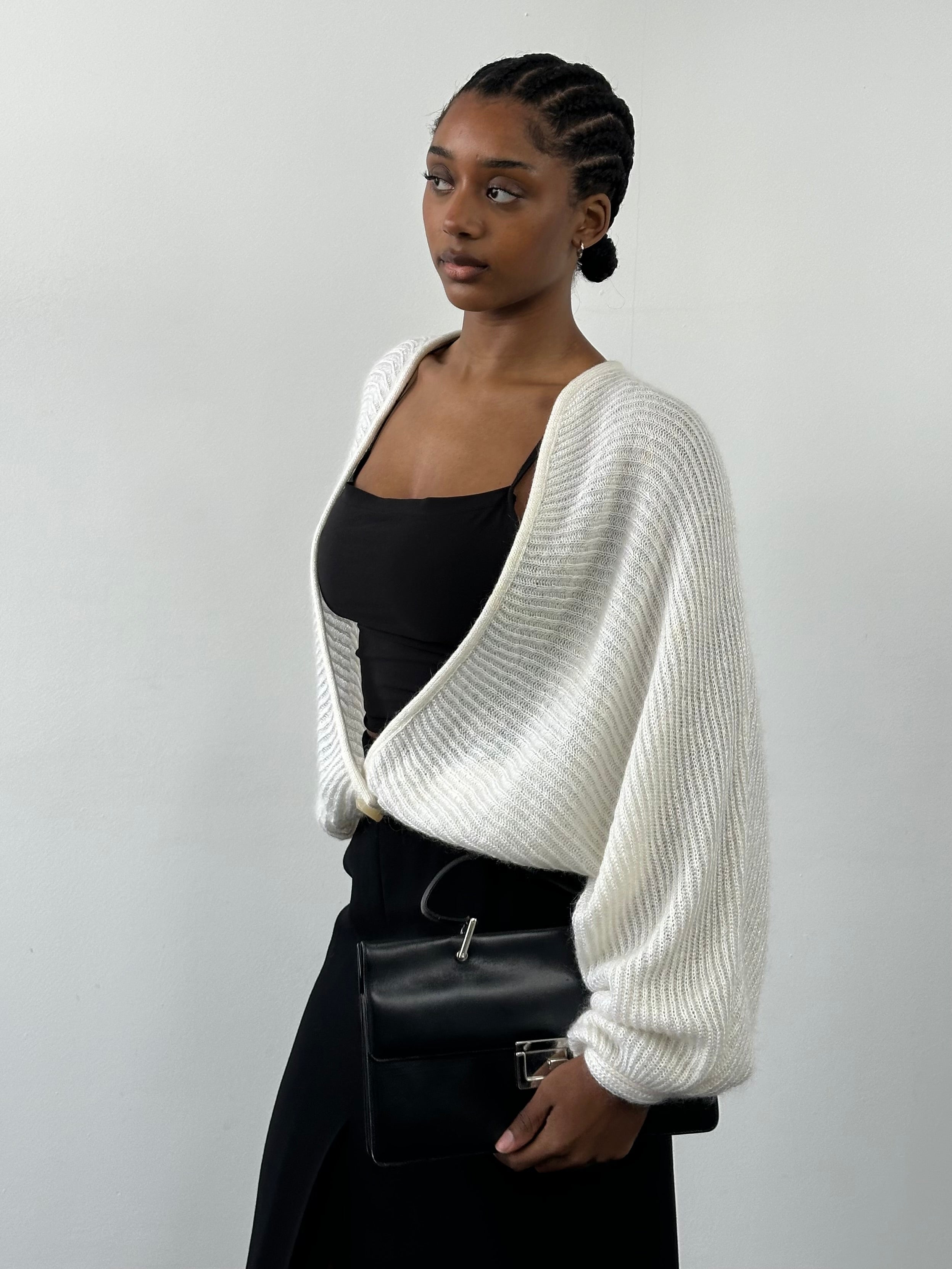 Vintage Italian 1990s mohair knitted cardigan in size M, featuring a soft, textured knit and classic design.