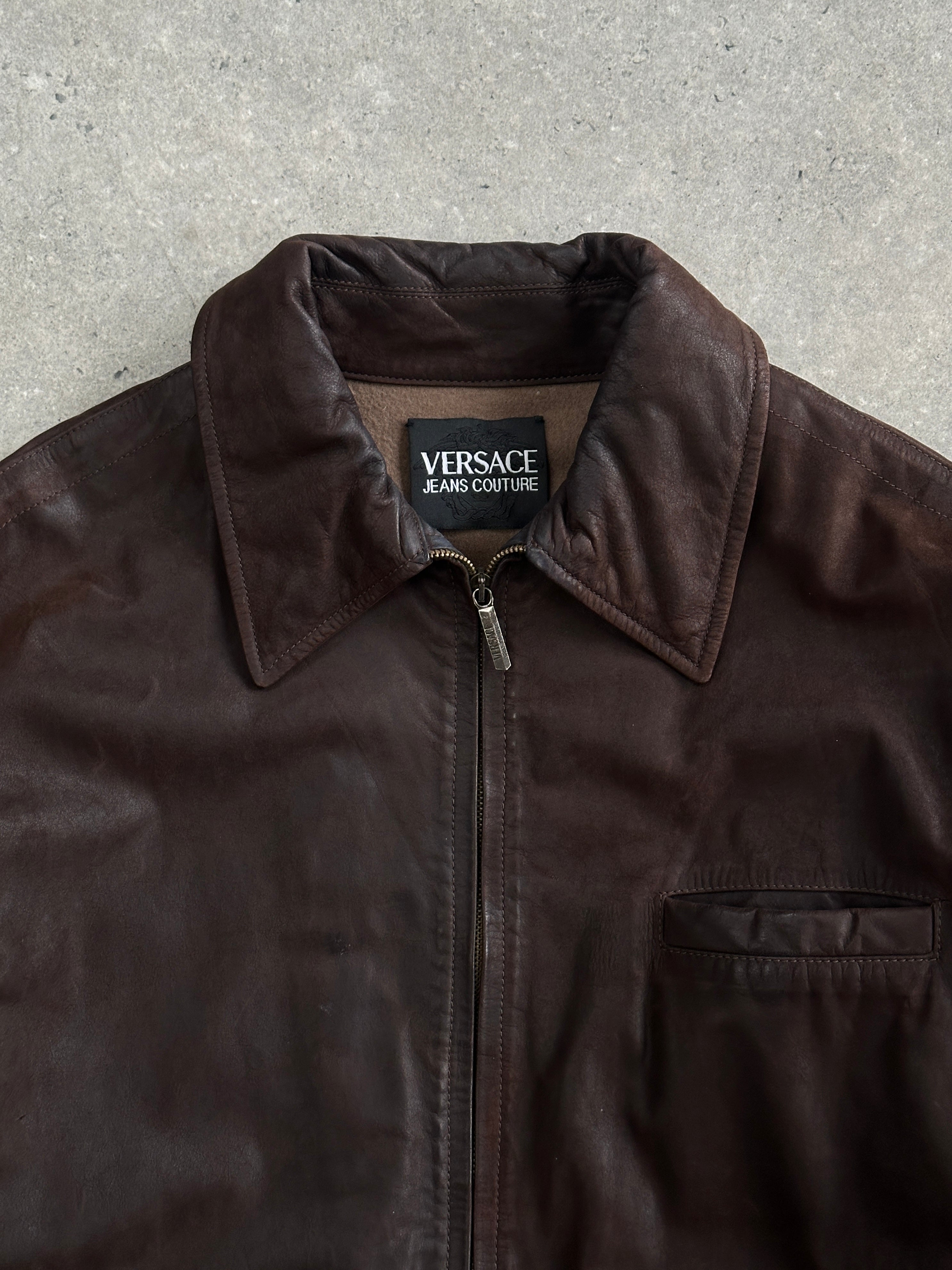 Versace Jeans Couture 1990s boxy leather jacket in black, featuring a classic design with a bold logo detail.