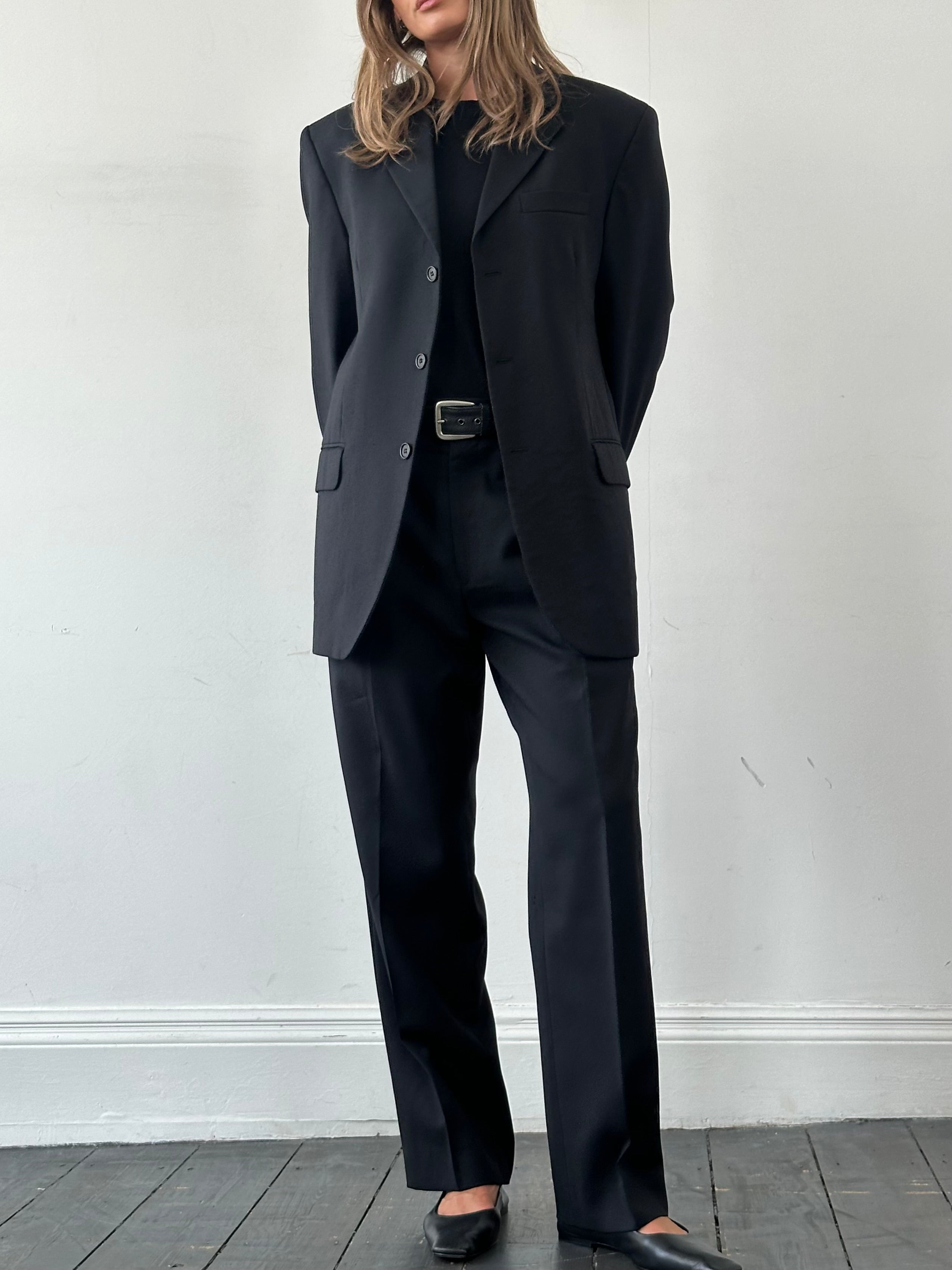 Yves Saint Laurent Pour Homme pure wool single-breasted suit in size 42R/W34, shown on a hanger, with classic tailored fit.