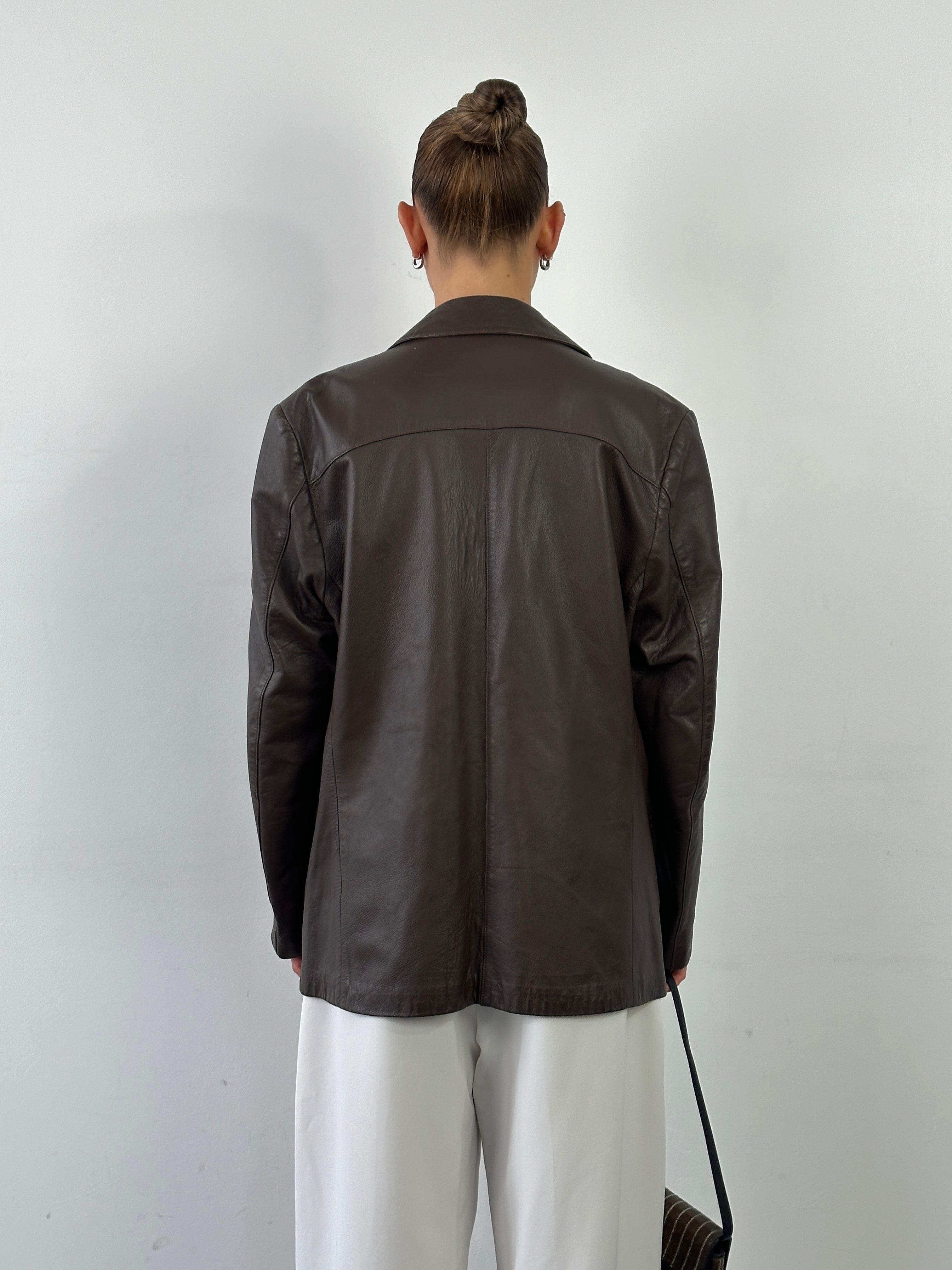 Vintage double-breasted leather blazer jacket in size large, featuring classic design and rich brown leather.