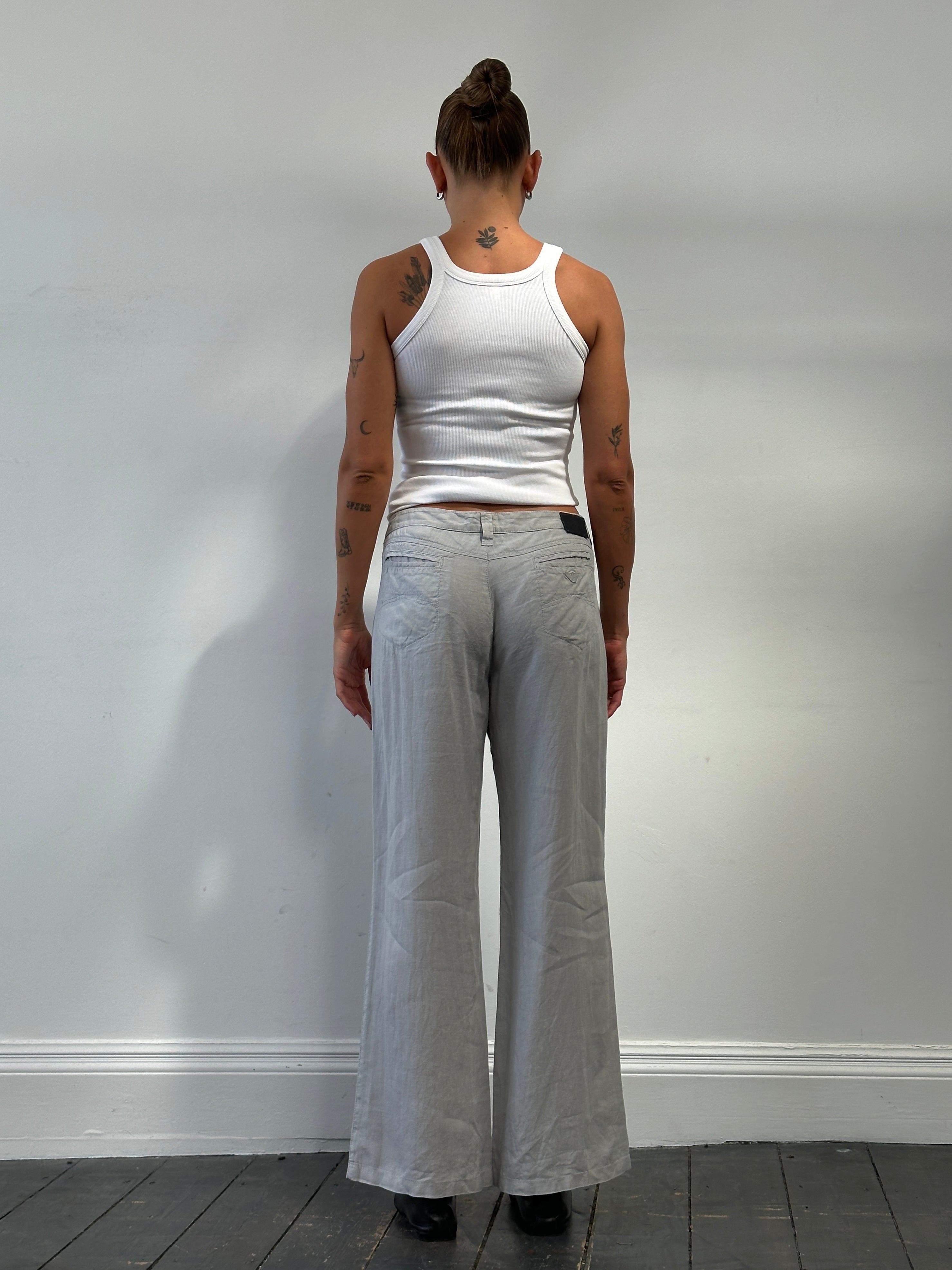 Armani Jeans pure linen flared trousers in size W33, lightweight and stylish, shown on a neutral background.