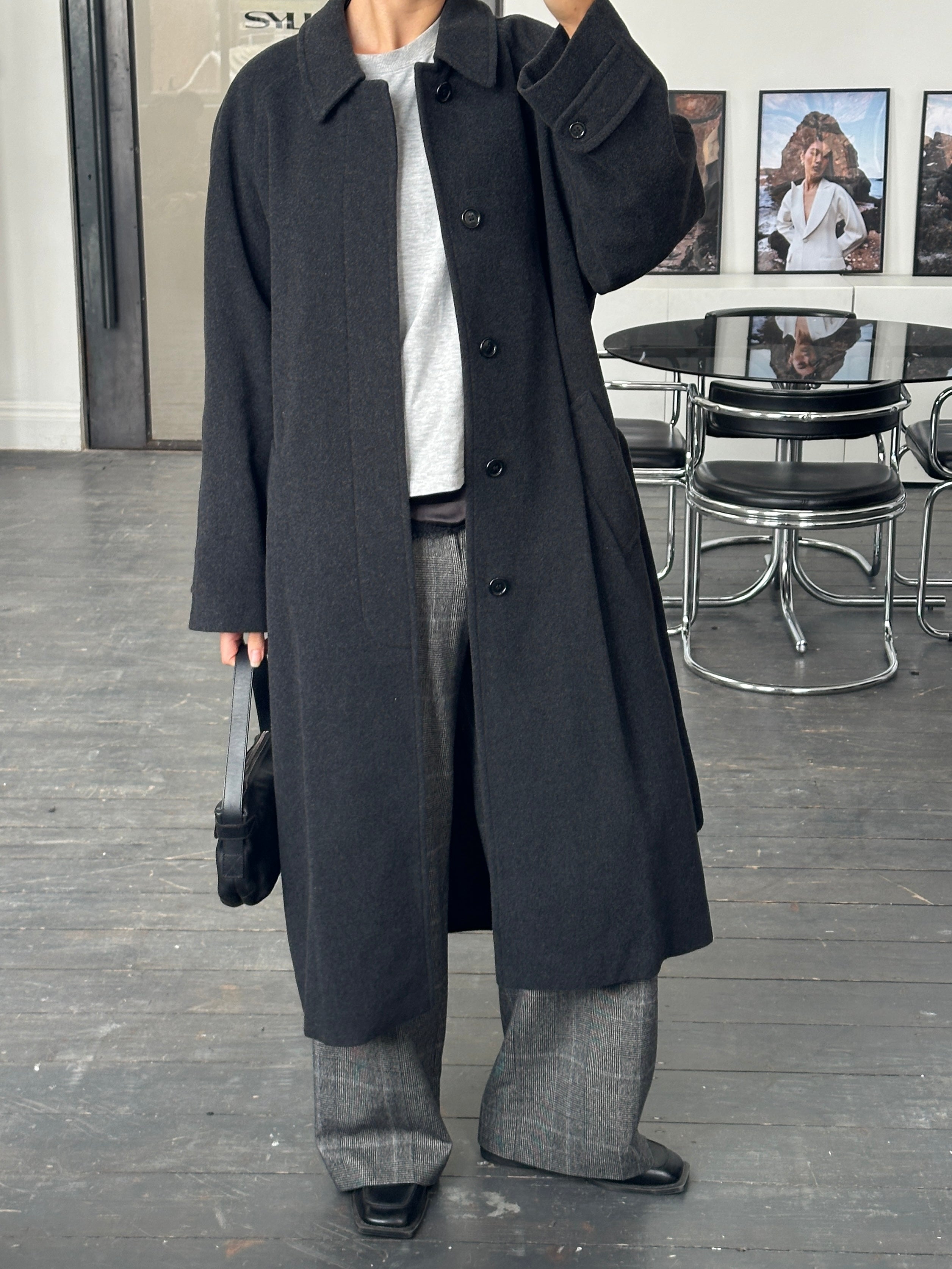 Vintage 1990s wool and cashmere belted coat in size L/XL, featuring classic design and warm, textured fabric.