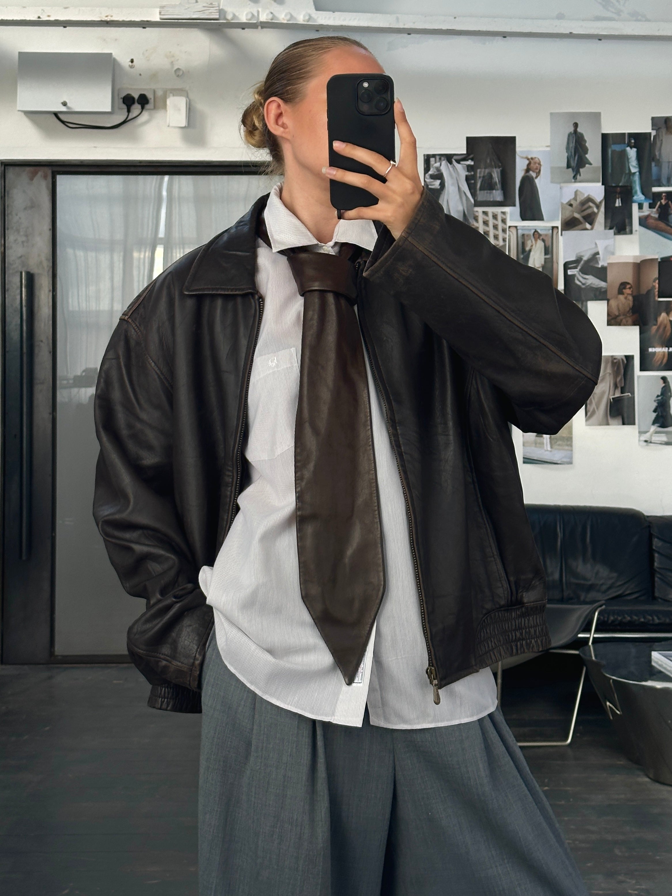 London Fog distressed leather jacket in size L, shown with a front view highlighting its rugged, vintage-inspired design.