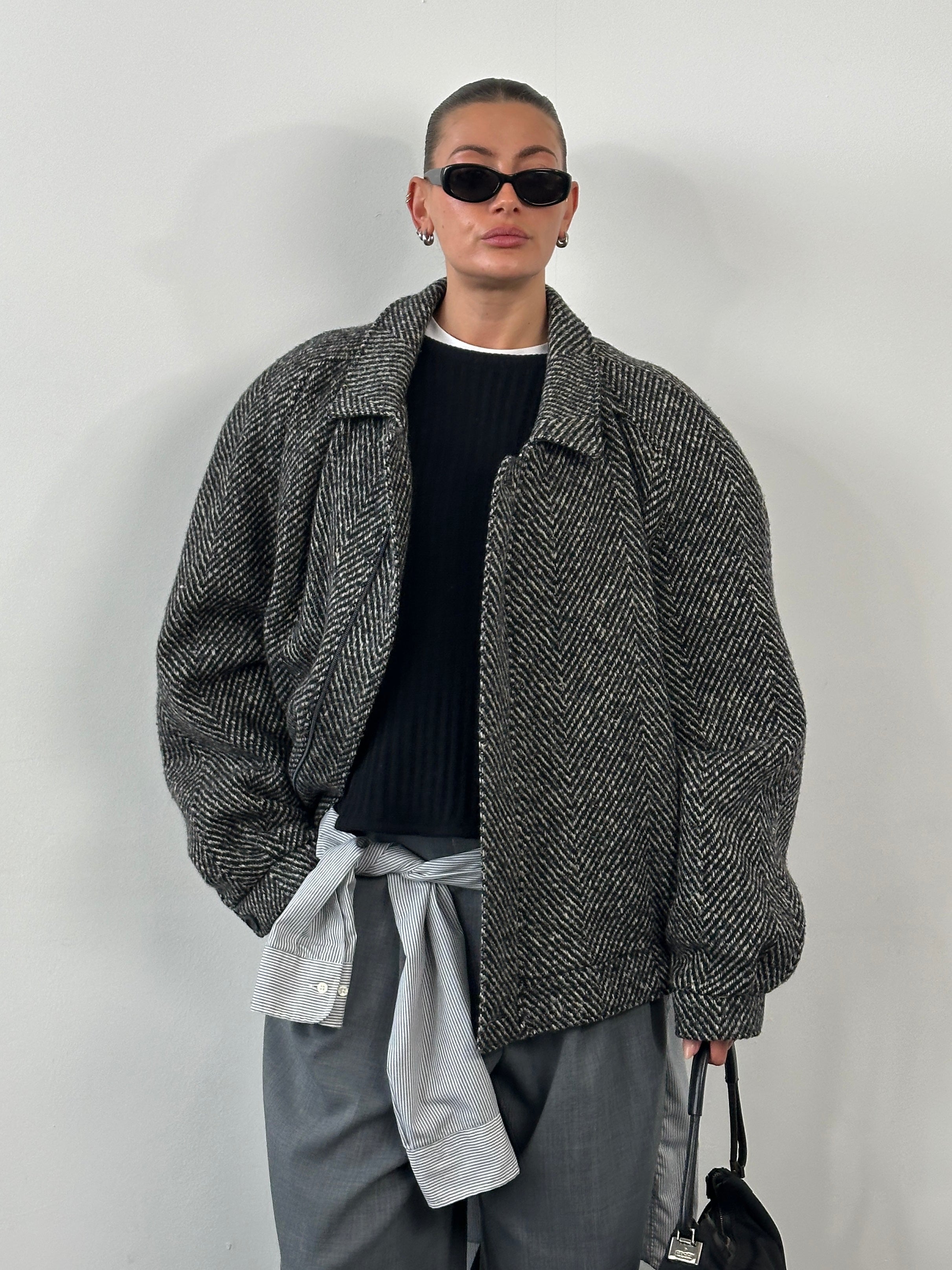 Vintage 1990s wool herringbone bomber jacket in XXL, featuring classic style and textured fabric, displayed on a hanger.