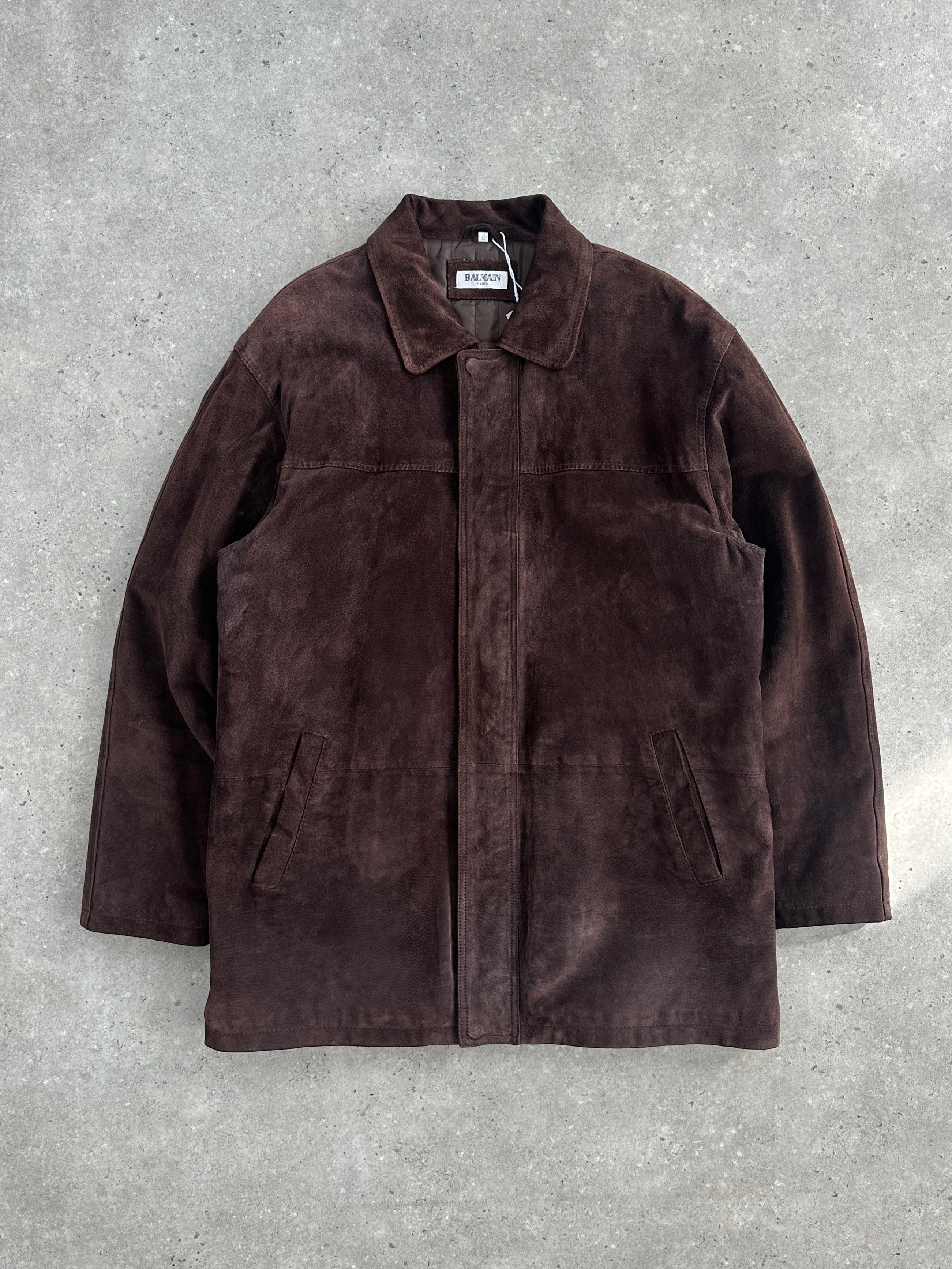 Balmain mid-length suede jacket in XL displayed on a hanger, showcasing its sleek design and rich suede texture.