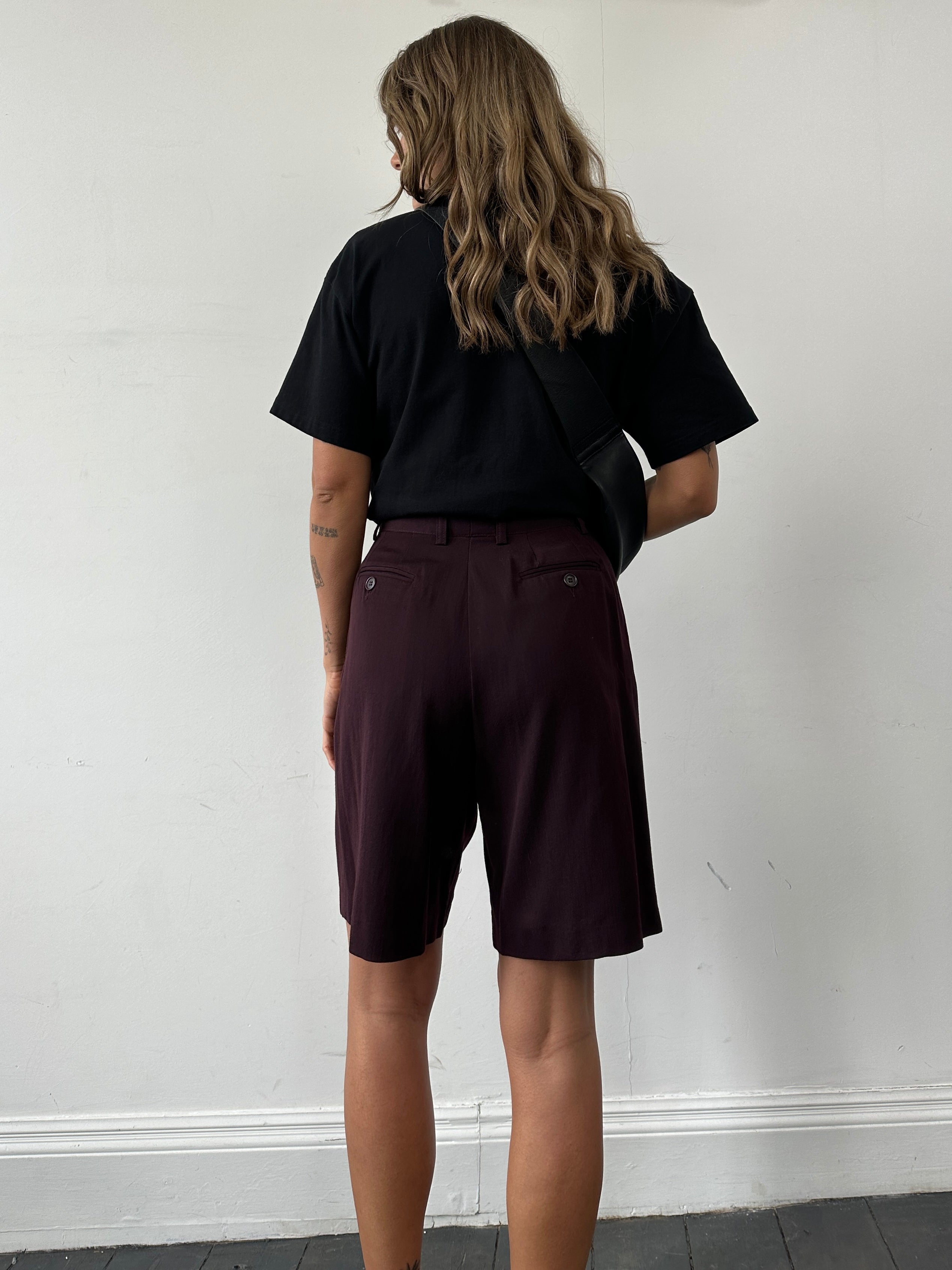 Emporio Armani wool high-waisted tailored shorts in black, front view showing clean lines and structured fit.