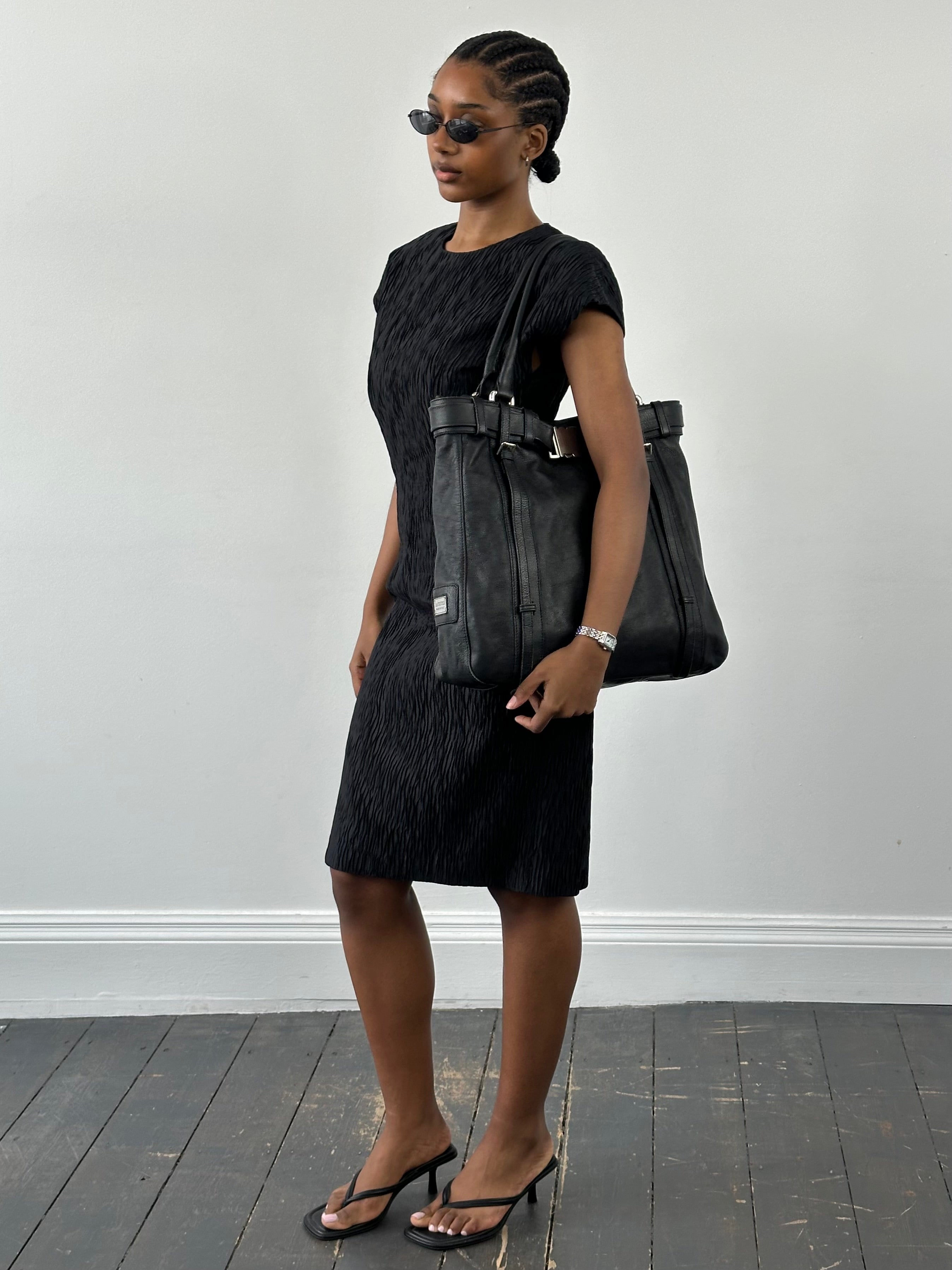 Vintage Italian vintage pleated sleeveless midi dress with a fitted waist and classic midi length, perfect for elegant summer style.