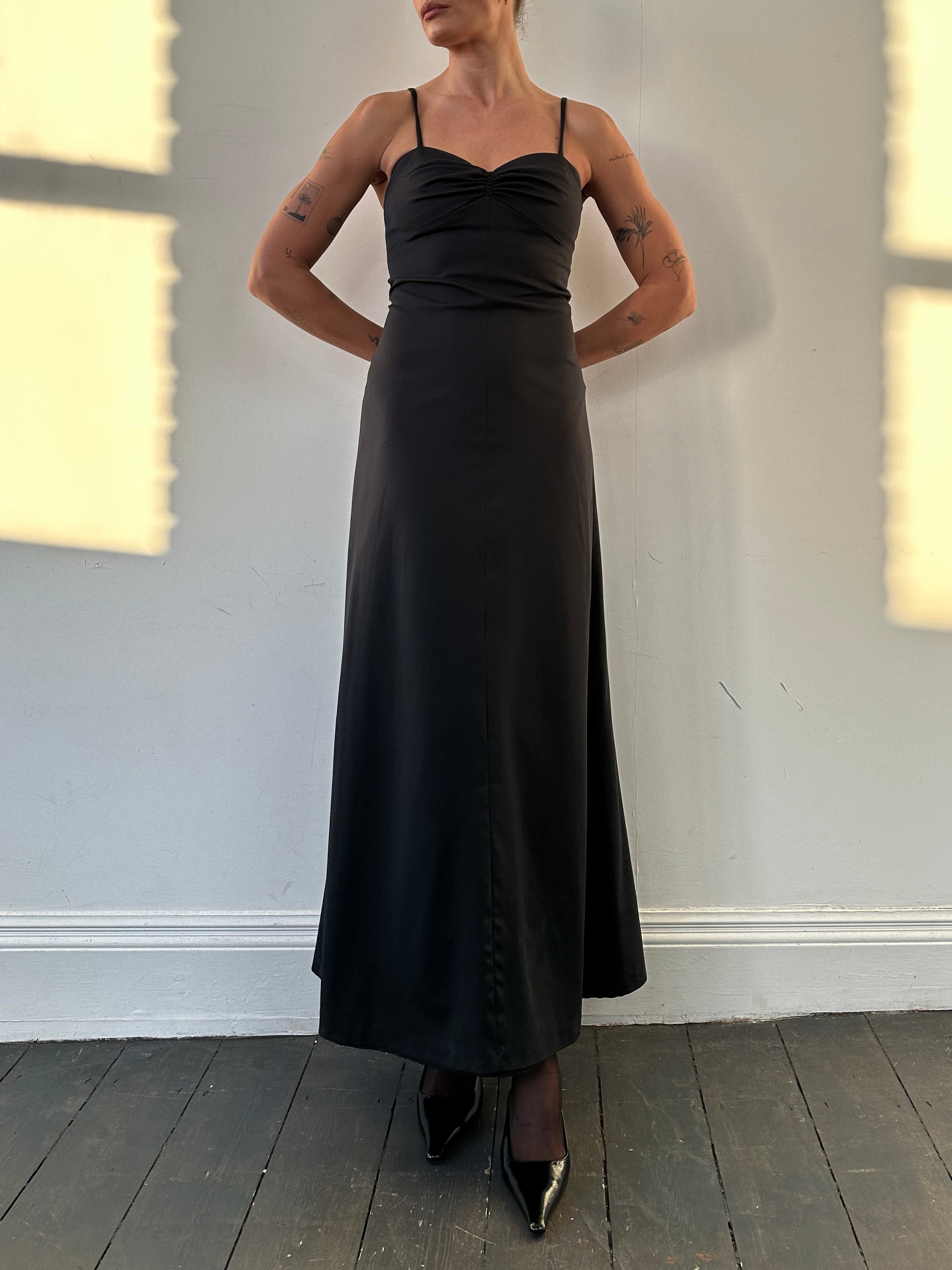 Vintage floor length fitted cami dress in size S/M, showcasing a sleek, elegant silhouette with a vintage-inspired design.