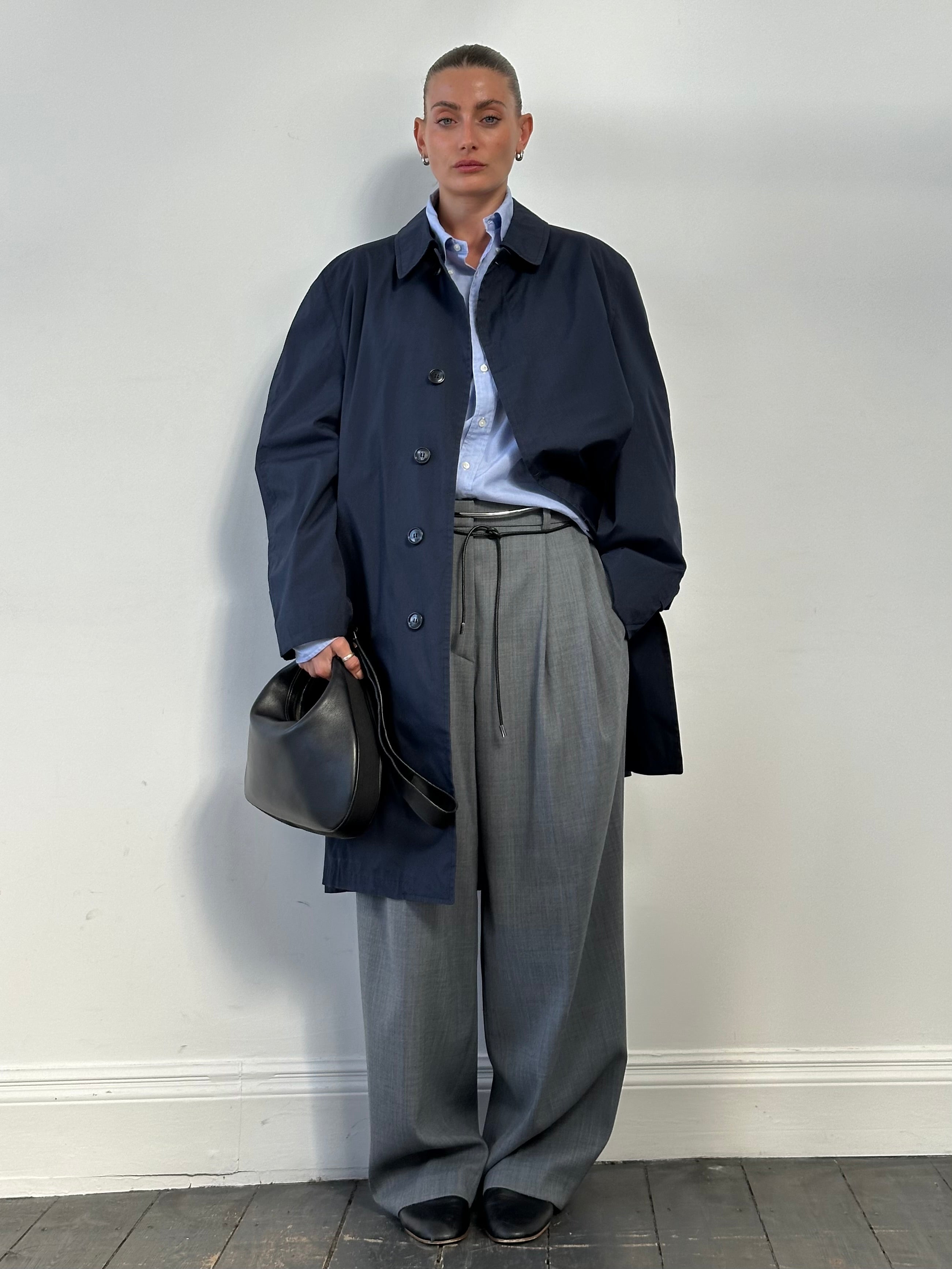 London Fog concealed placket trench coat in XL, showing classic beige color, belted waist, and double-breasted design.