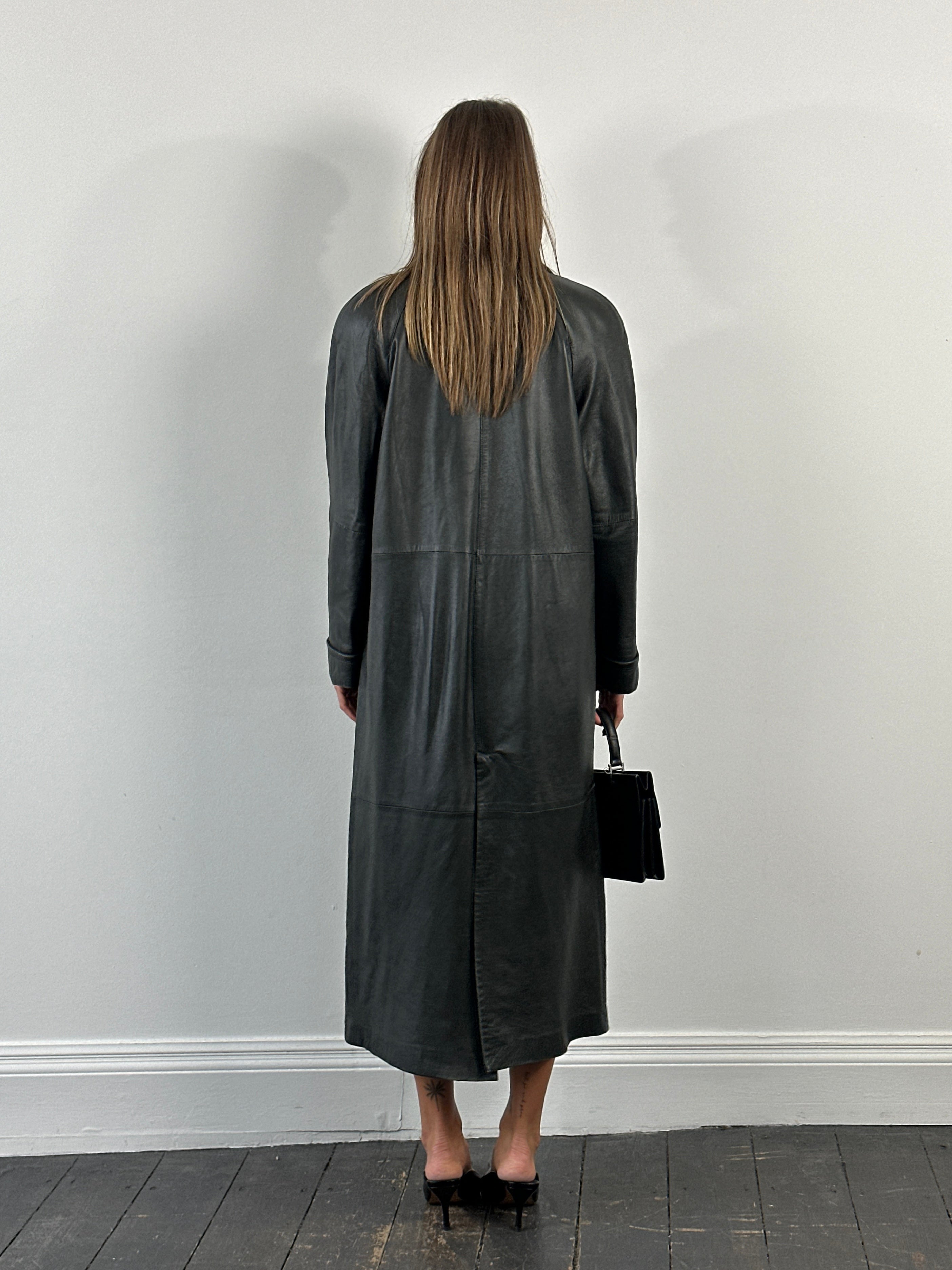 Vintage 1990s leather trench coat jacket in floor length style, showcasing classic design and rich brown leather.