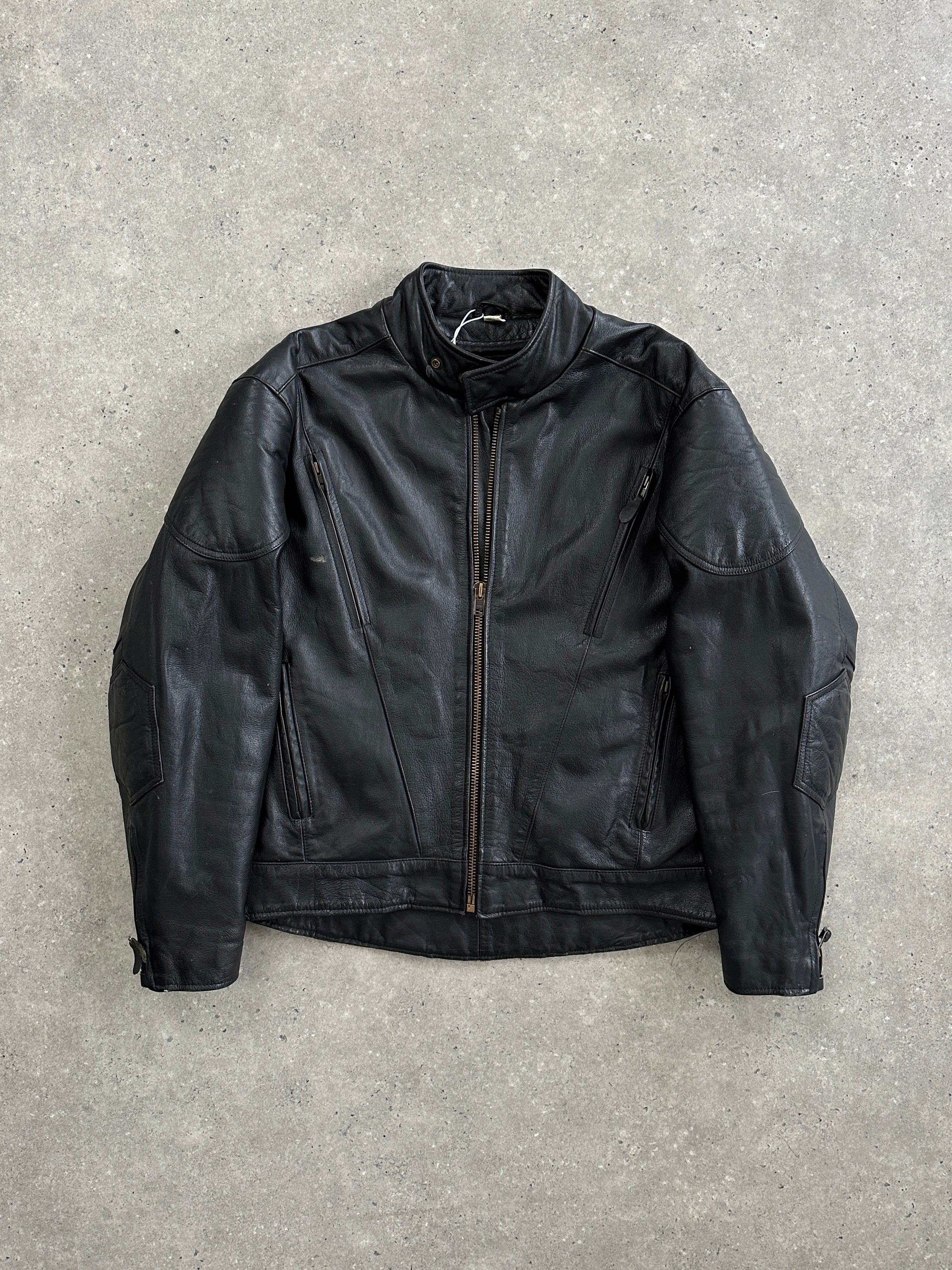 Vintage leather motorcycle jacket in XL size, featuring classic style and detailed stitching, displayed on a hanger.