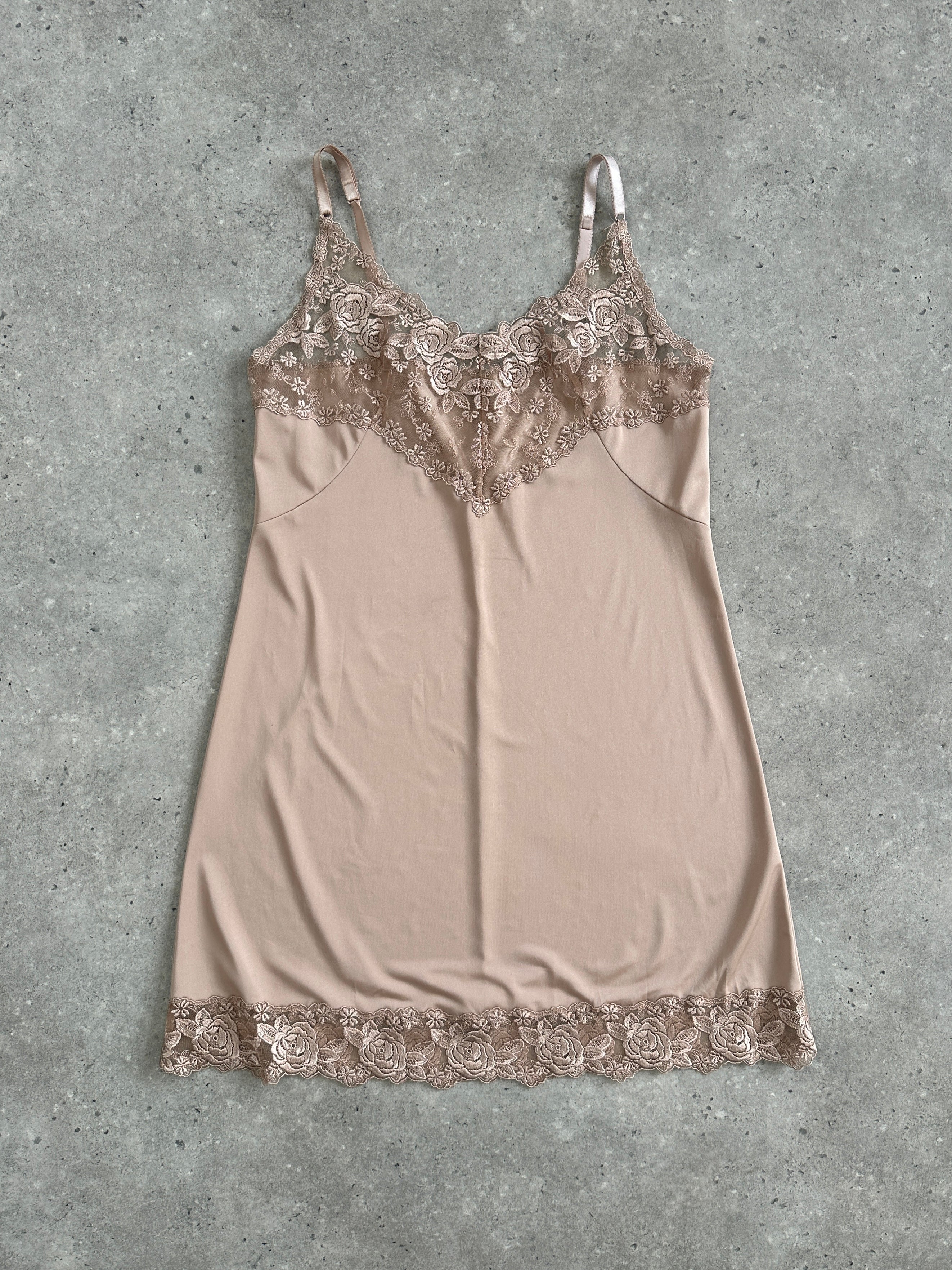 Vintage 1990s lace mini slip dress in size M, featuring delicate lace fabric and a classic, feminine silhouette.