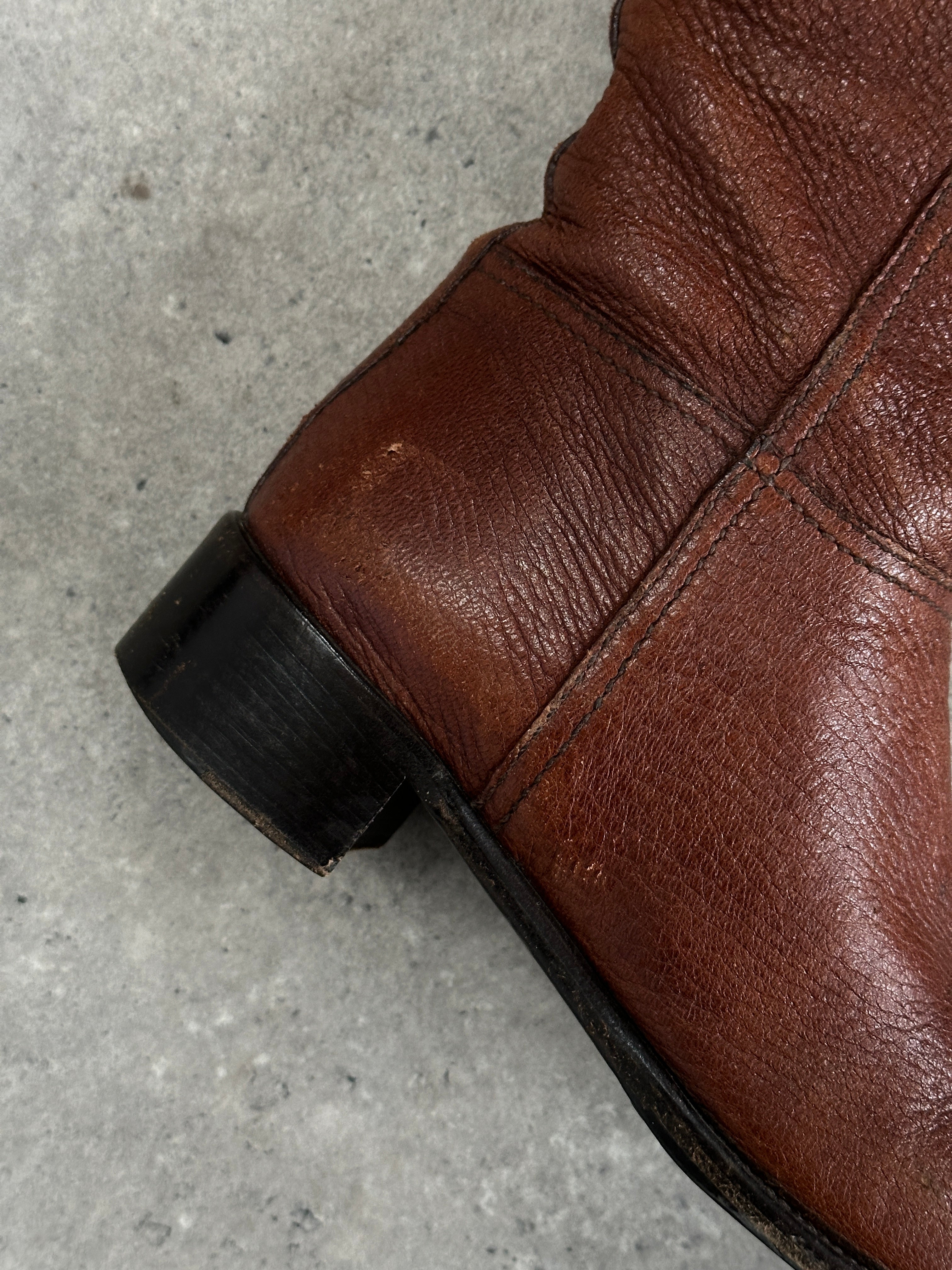 Prada leather knee boots with logo details in black, featuring a sleek design and pointed toe, UK size 4 / EUR 37.