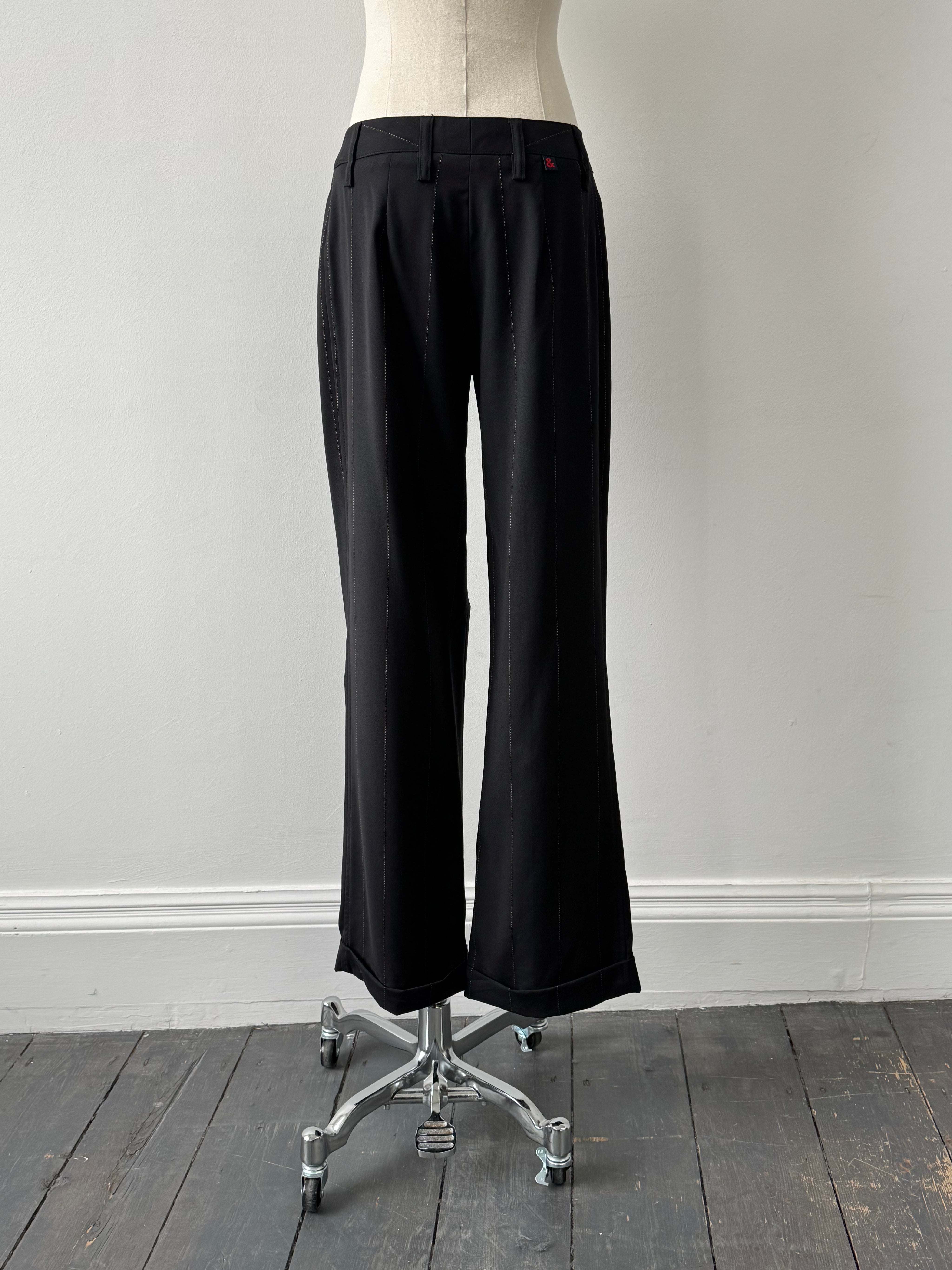 Dolce & Gabbana 2000s wool trousers in size W28, tailored fit with classic design and subtle detailing.
