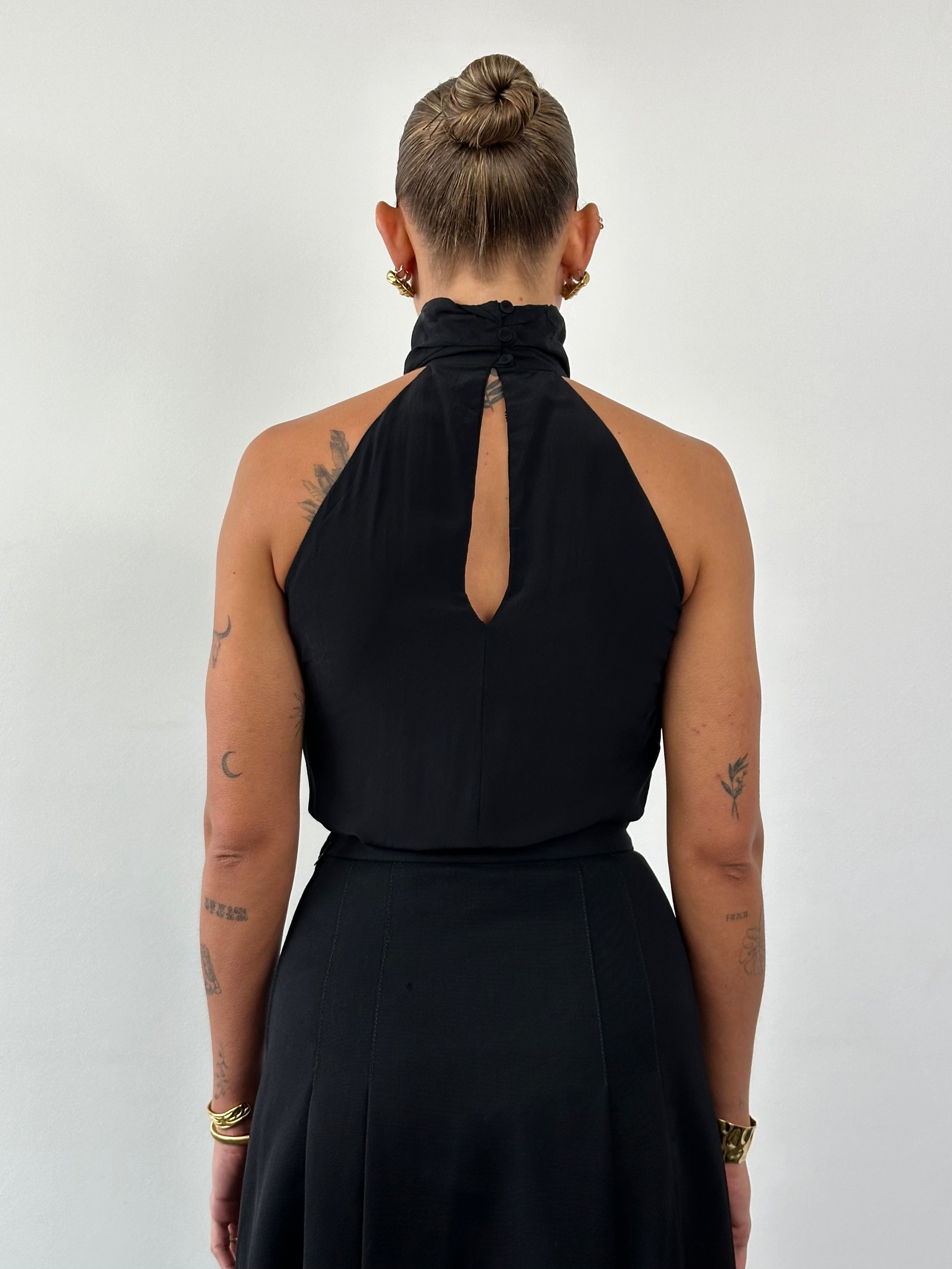 Vintage brand vintage halter neck layered tank top in size small, featuring a stylish layered design and sleeveless fit.