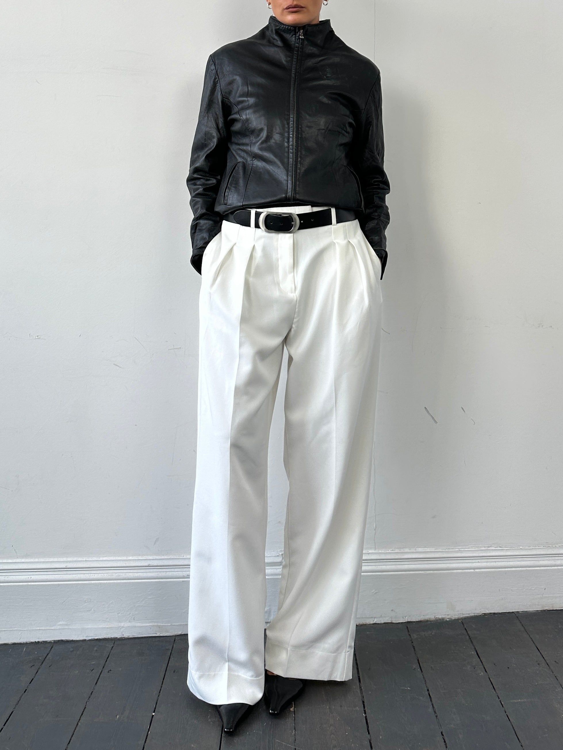 Vintage Italian leather high-neck jacket with double zip closure, stylish and classic design in size small.
