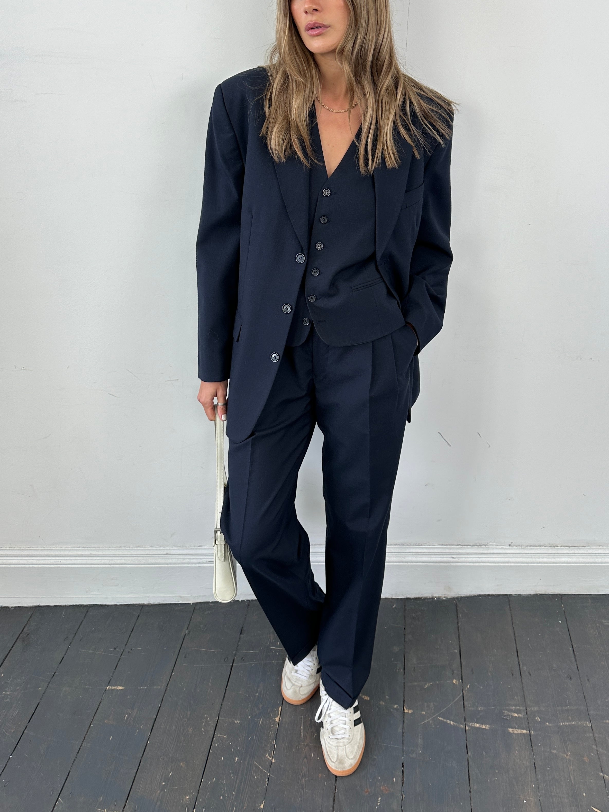 Vintage wool blend single-breasted three-piece suit in size 38R/W30, featuring classic tailored jacket, vest, and trousers.