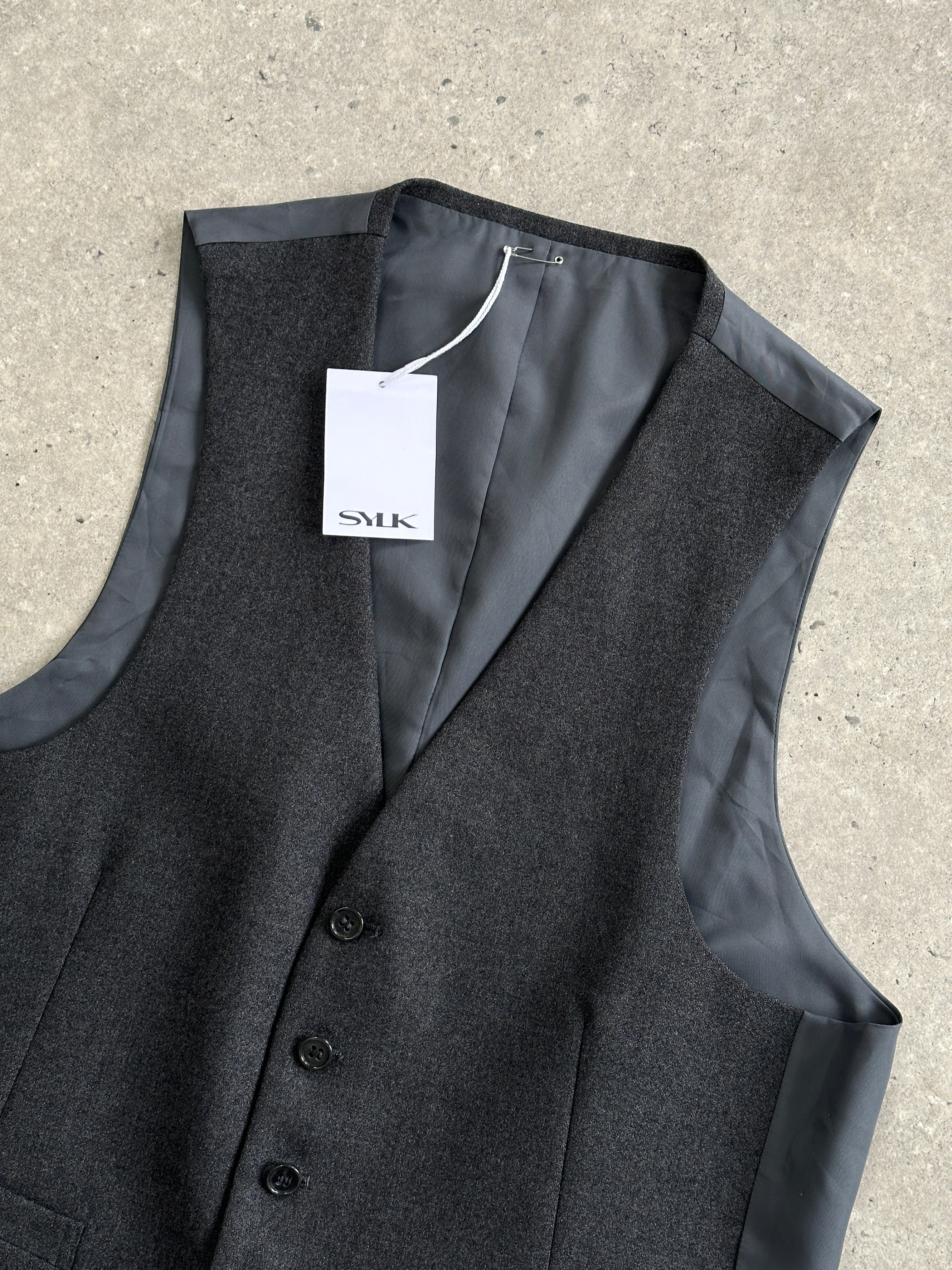 Vintage pure wool single-breasted tailored waistcoat in size L, showcasing classic design and craftsmanship.