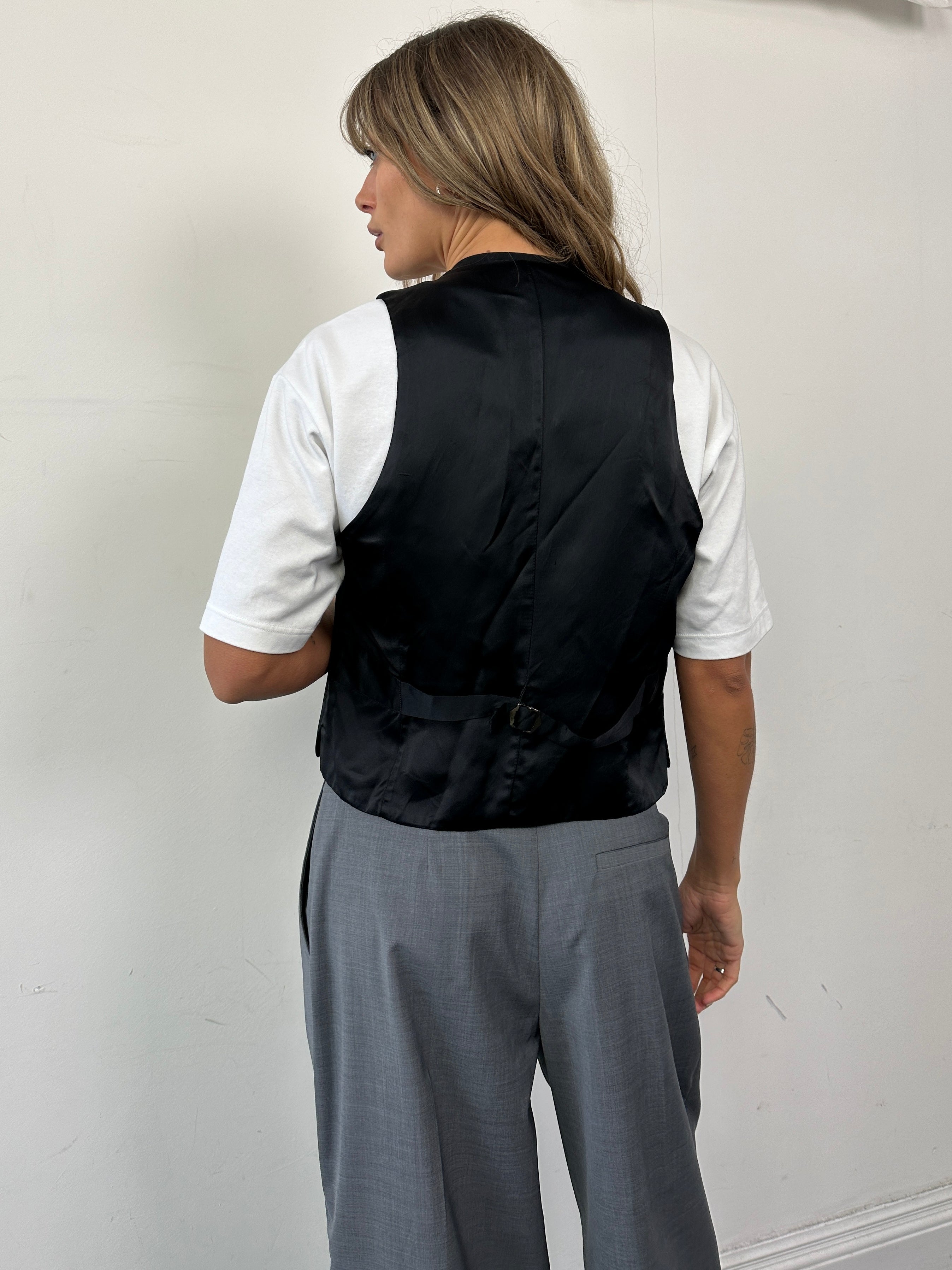 Vintage wool blend tailored waistcoat in size M, featuring classic design and button details in a close-up product image.