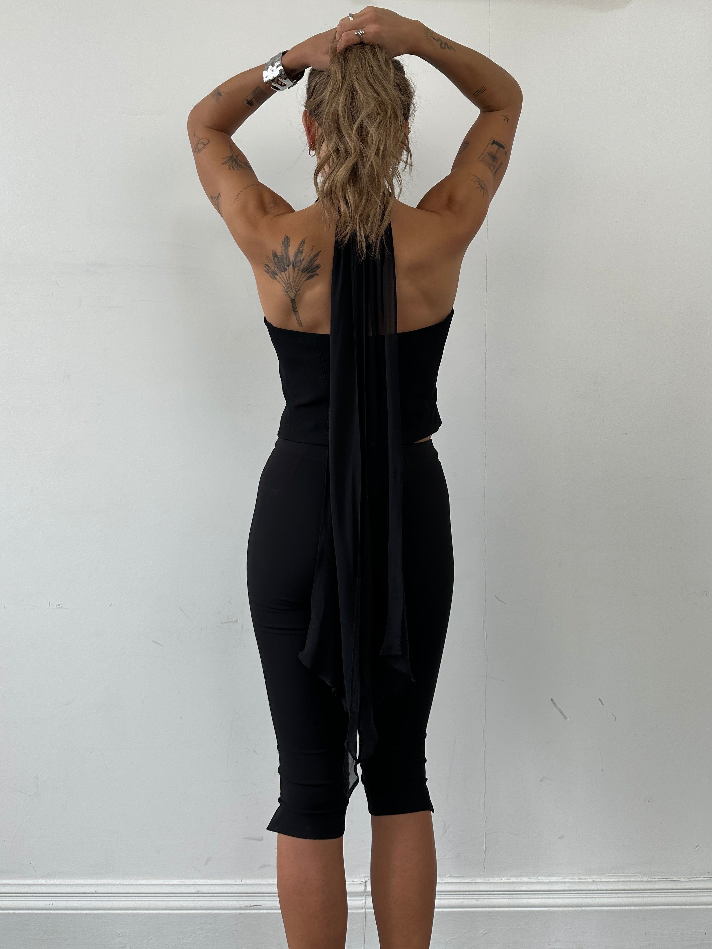Emporio Armani 2002 pure silk halter neck waistcoat in black, tailored with a sleek halter design and waist-length fit.