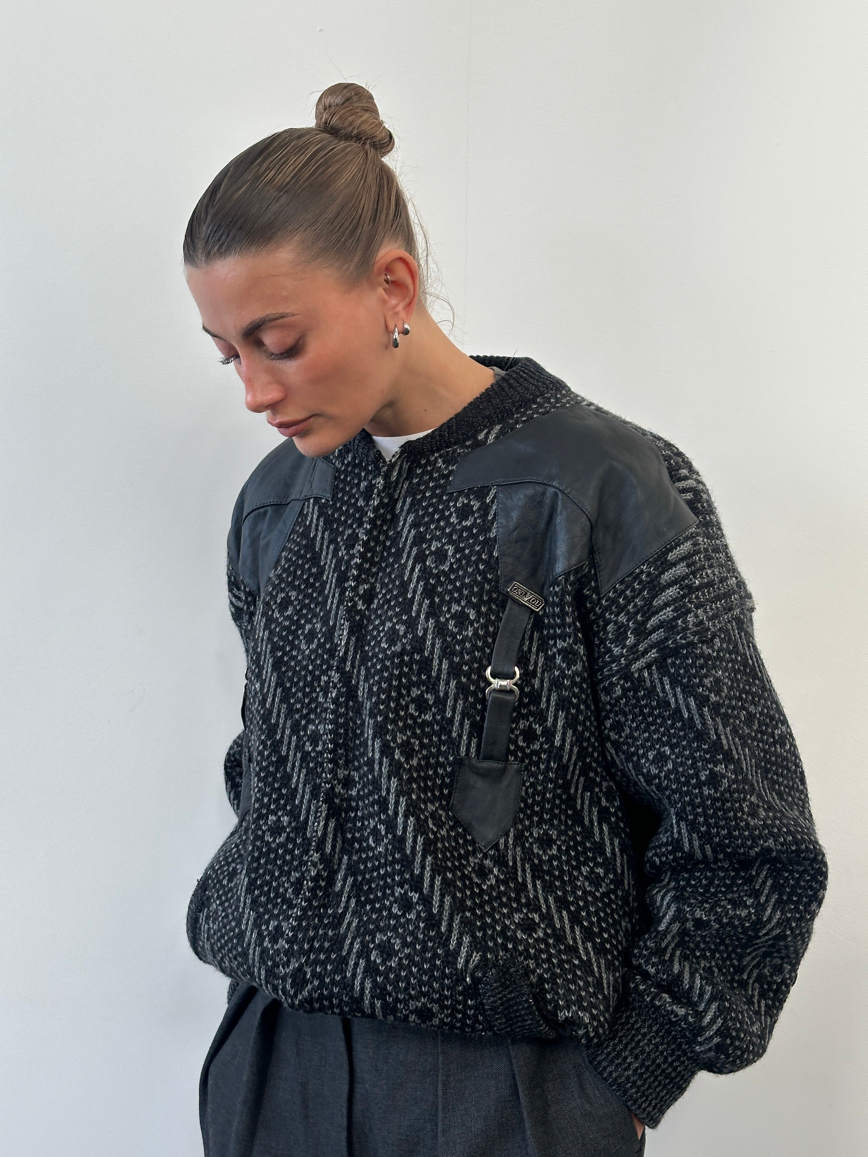 Vintage 1980s wool print knit bomber jacket in XL, featuring colorful geometric patterns and classic bomber style.