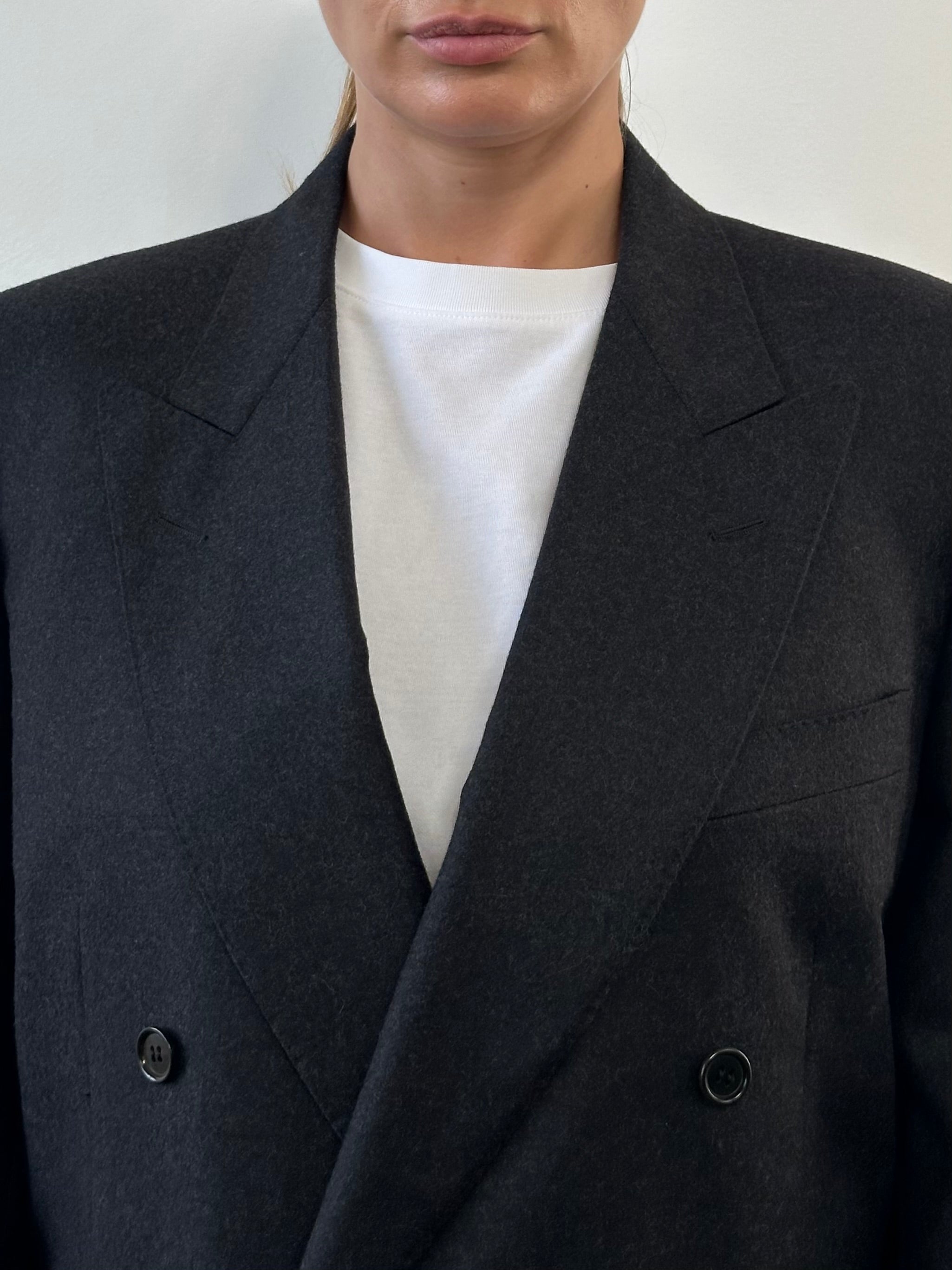 Vintage Italian double-breasted blazer in size M/L, featuring classic tailoring and vintage fabric, displayed on a neutral background.