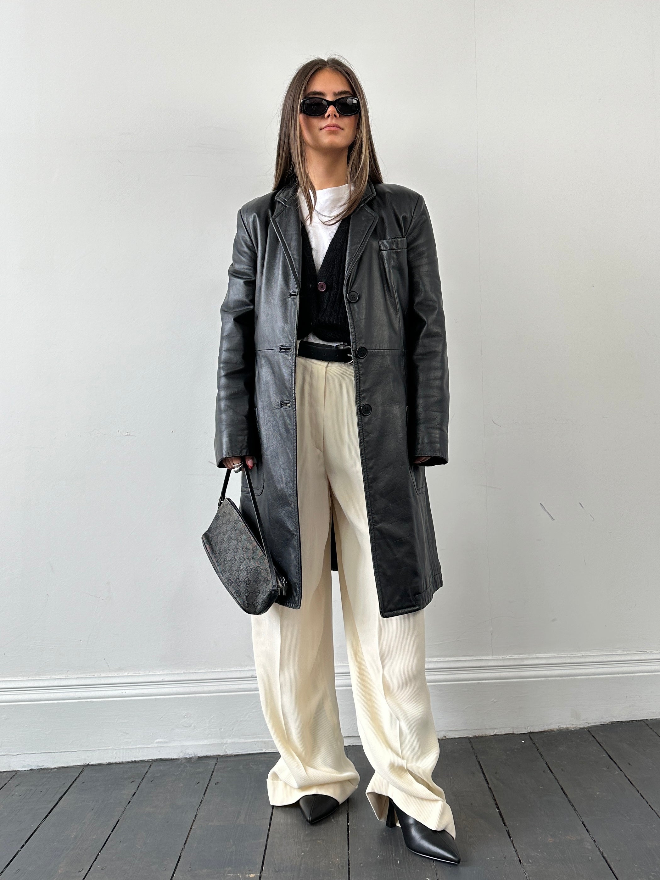 Armani leather trench coat for women, XS size, featuring a sleek design and classic silhouette, displayed on a plain background.