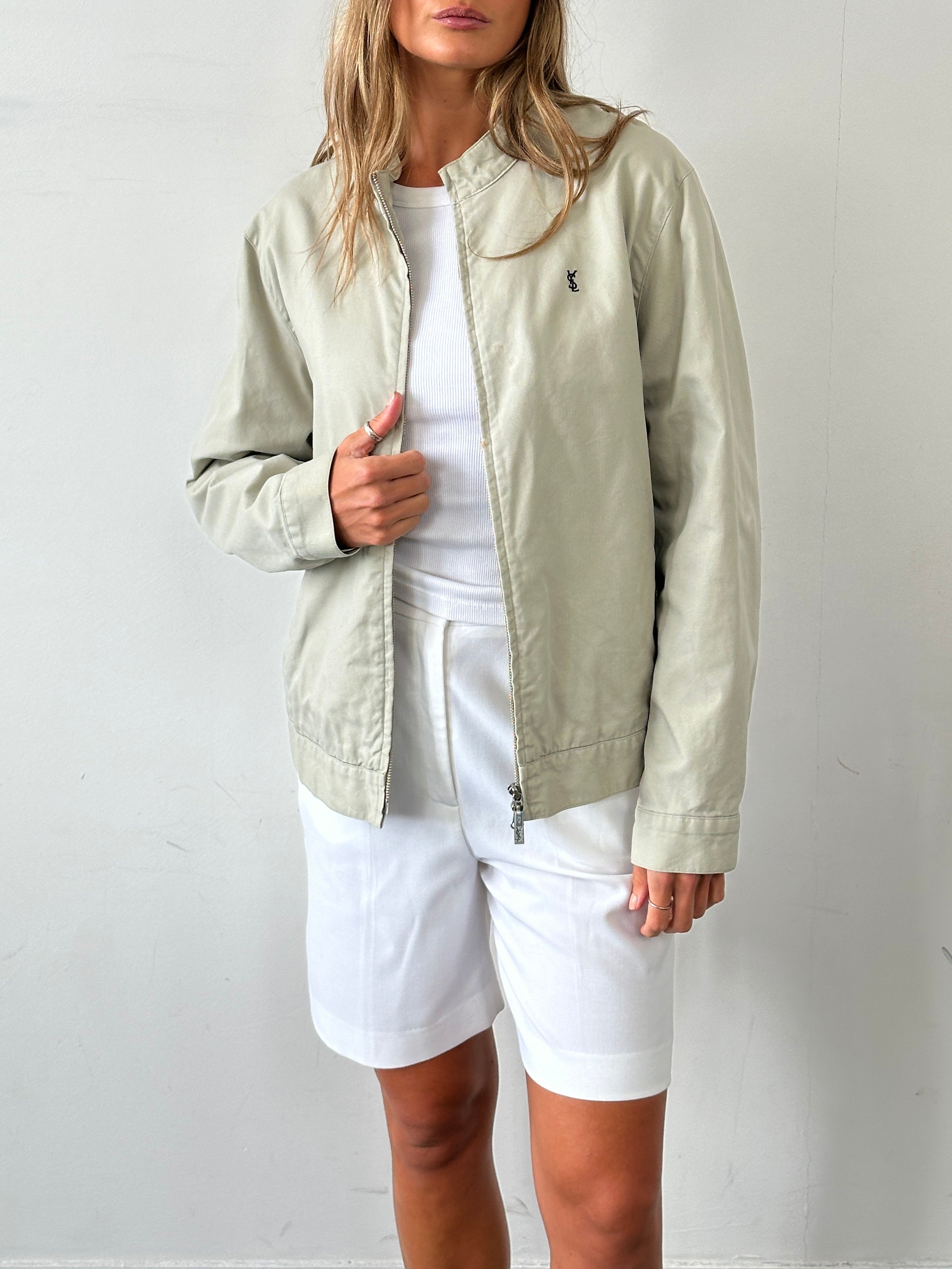 Yves Saint Laurent Pour Homme cotton bomber jacket with double zip and logo details, in black, size M/L, on a hanger.