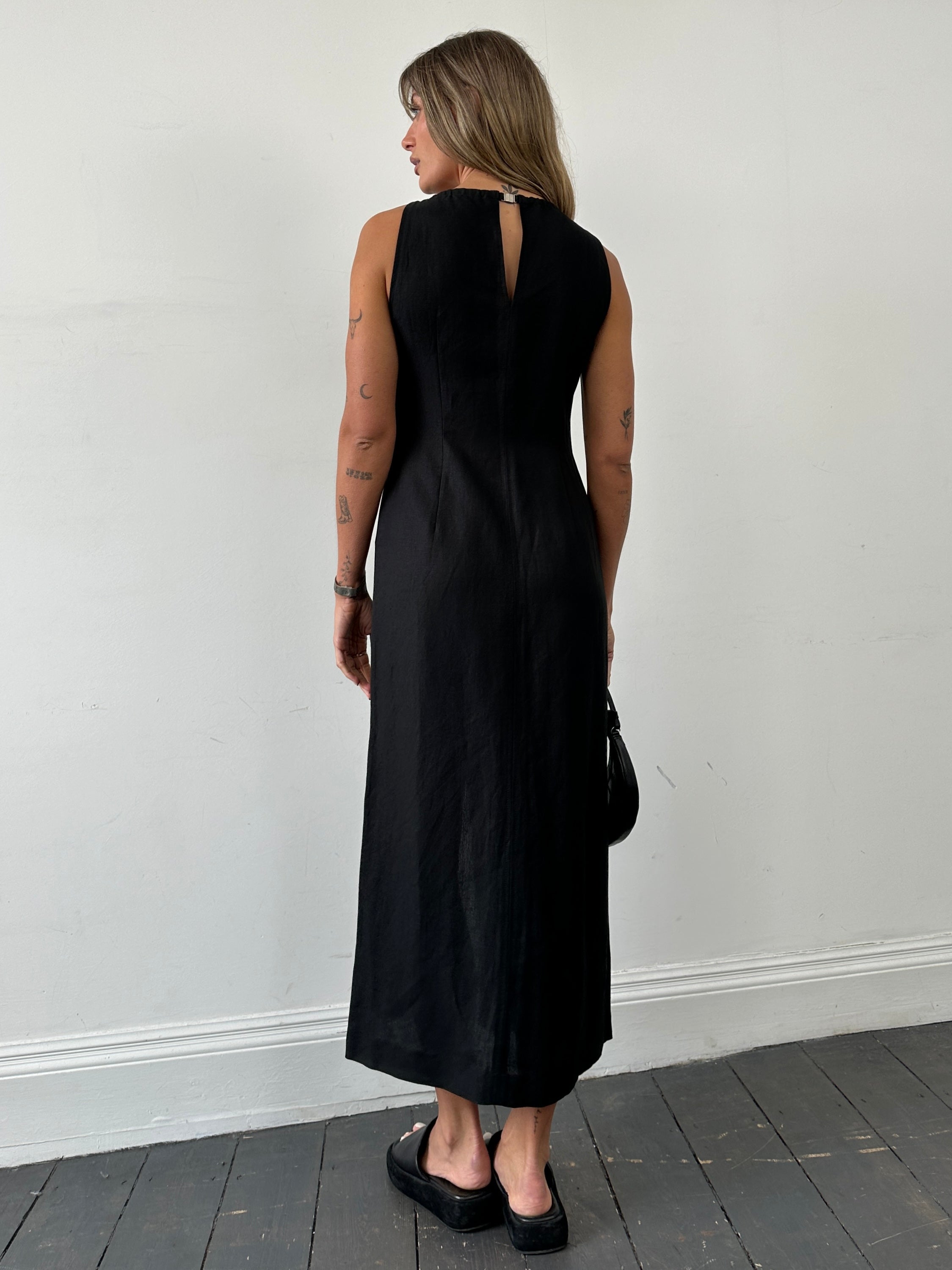 Marella linen floor-length dress in size M, elegant and breathable with a flowing silhouette, displayed on a mannequin.