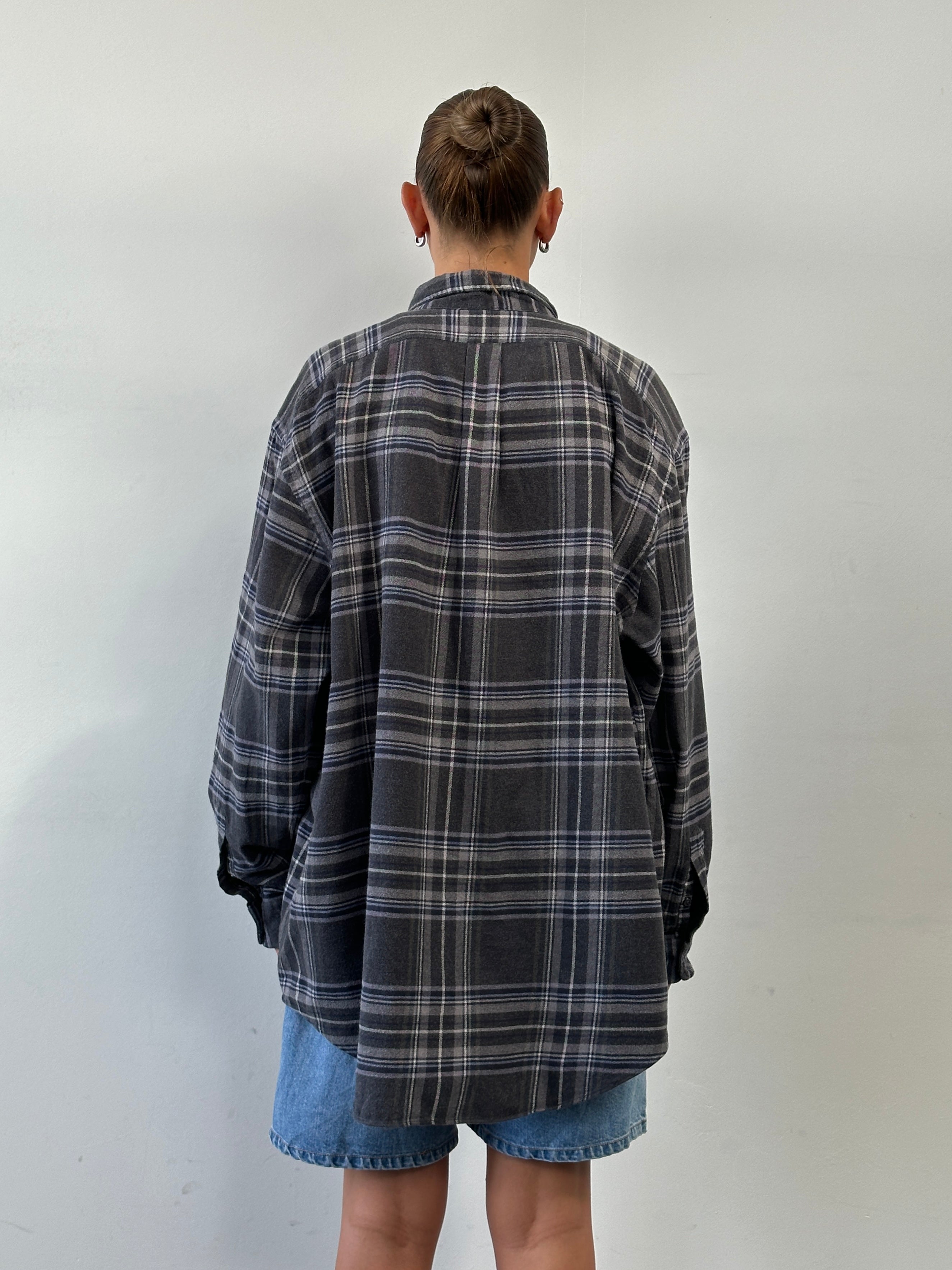 Ralph Lauren XXL pure cotton flannel logo shirt displayed on a hanger, featuring a classic plaid pattern and the brand's logo.