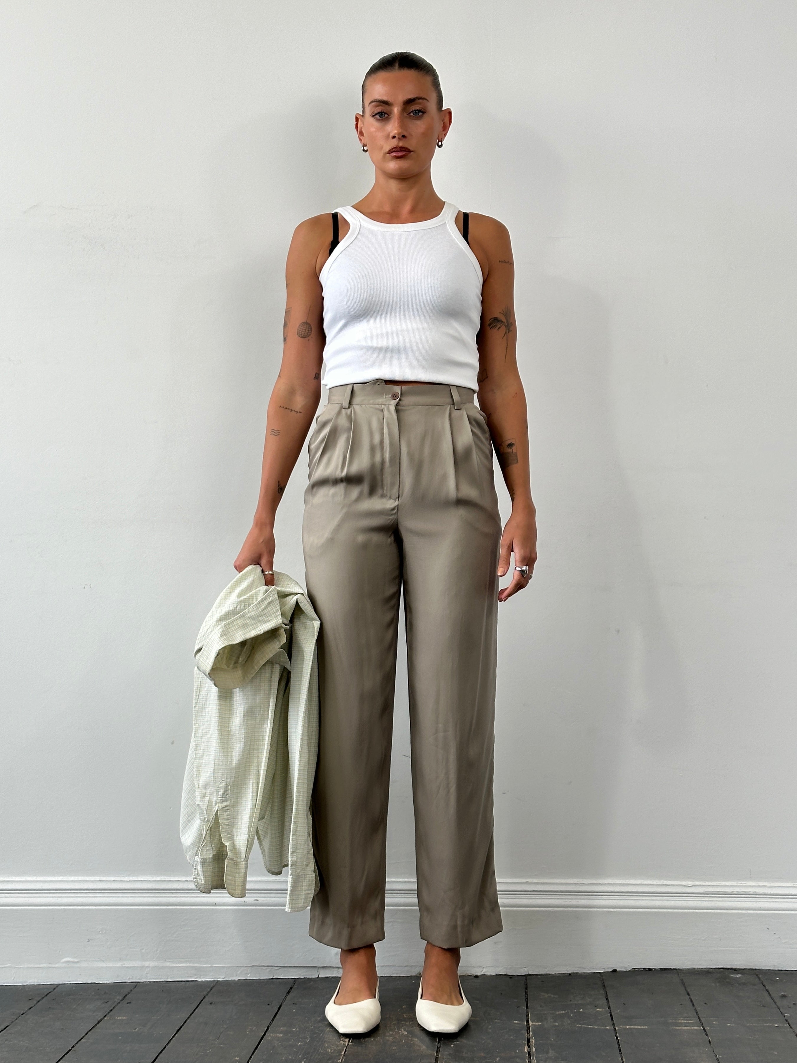 Mani Pure Silk high-waisted trousers in a sleek design, shown in black, with a tailored fit and smooth silk fabric.