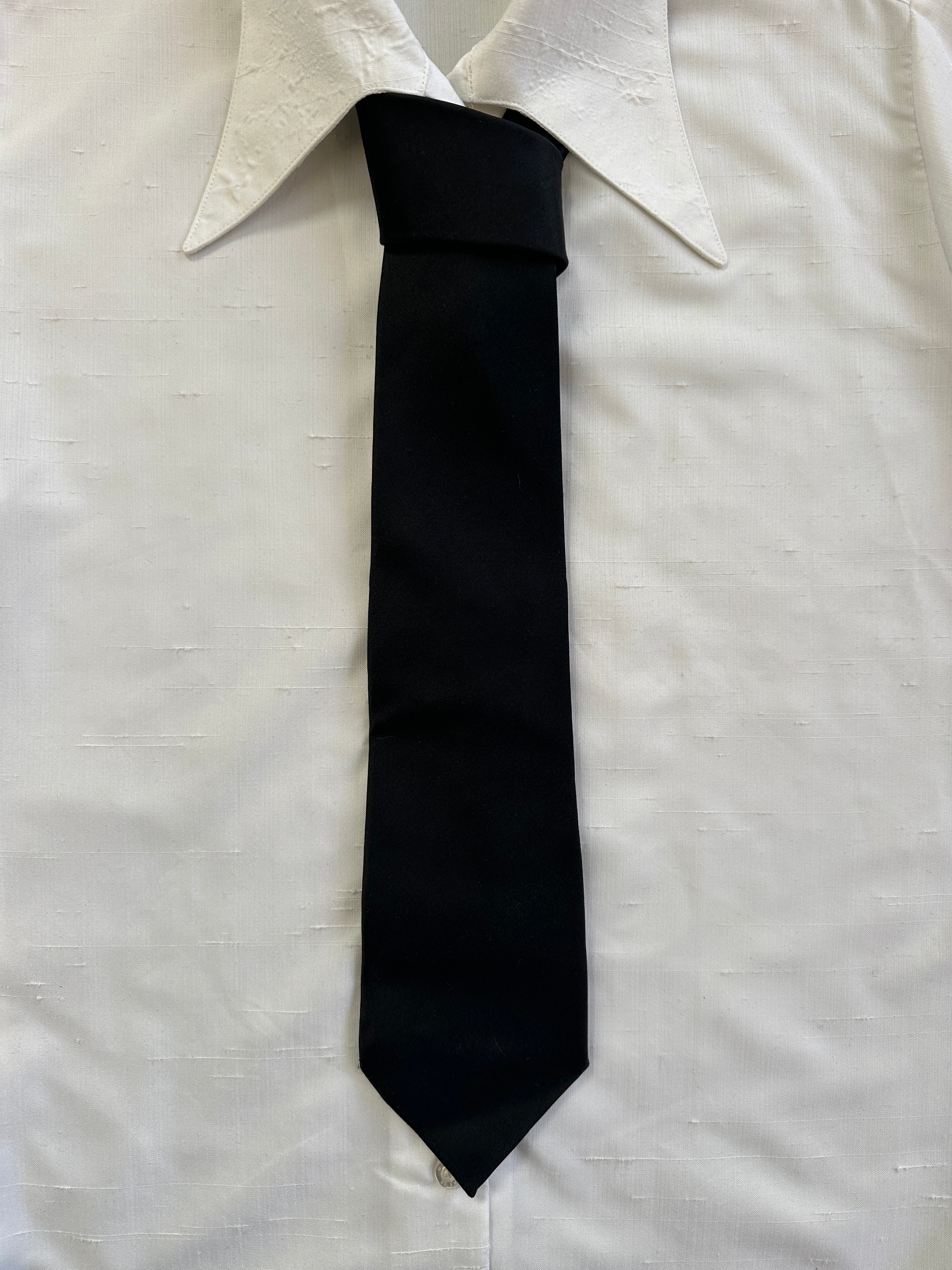 Pierre Cardin 2000s pure silk tie featuring a classic pattern and smooth texture, displayed flat on a neutral background.