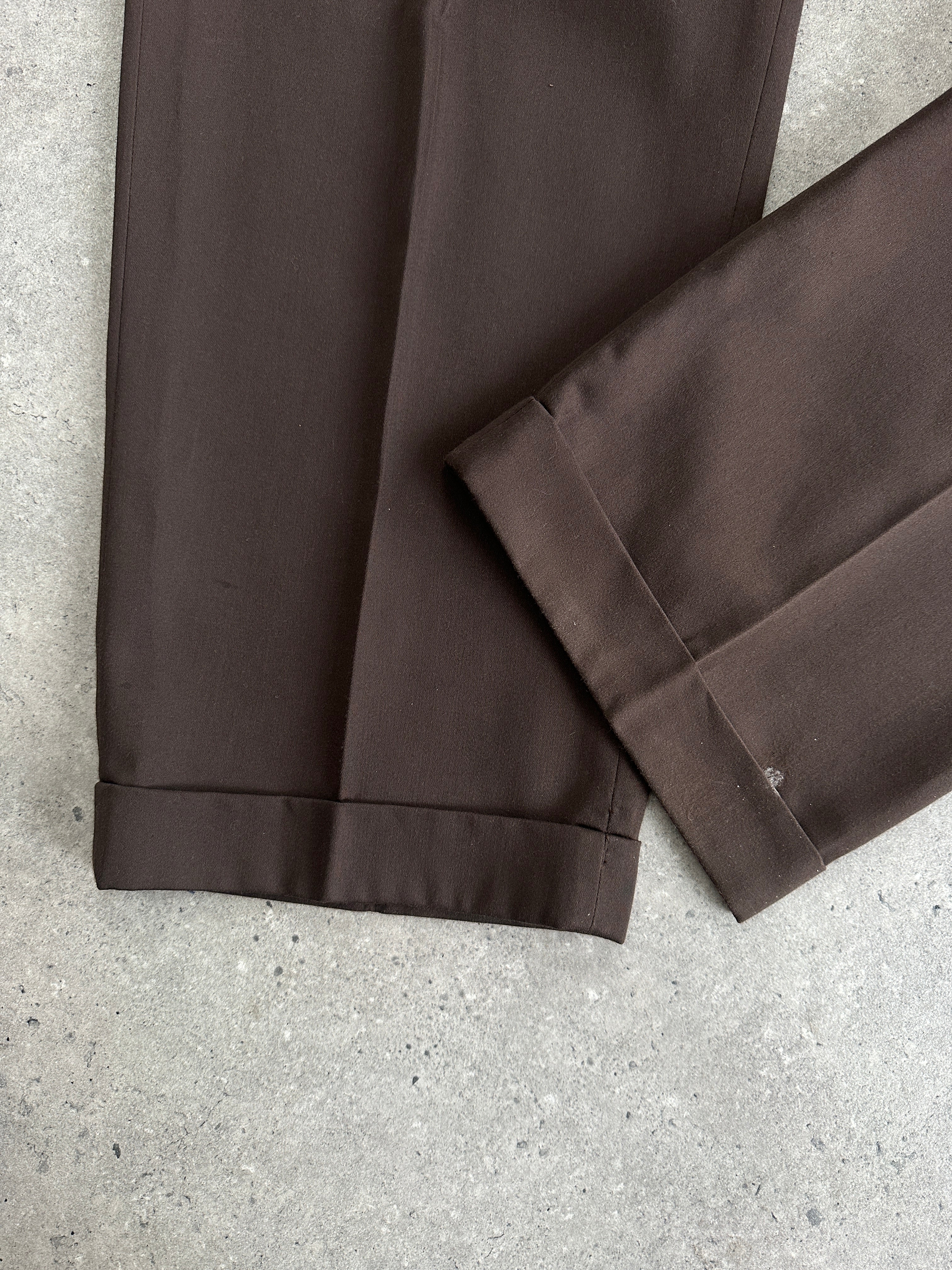 Vintage double-breasted jumpsuit in size 40R/W32, featuring classic style with wide lapels and tailored fit.