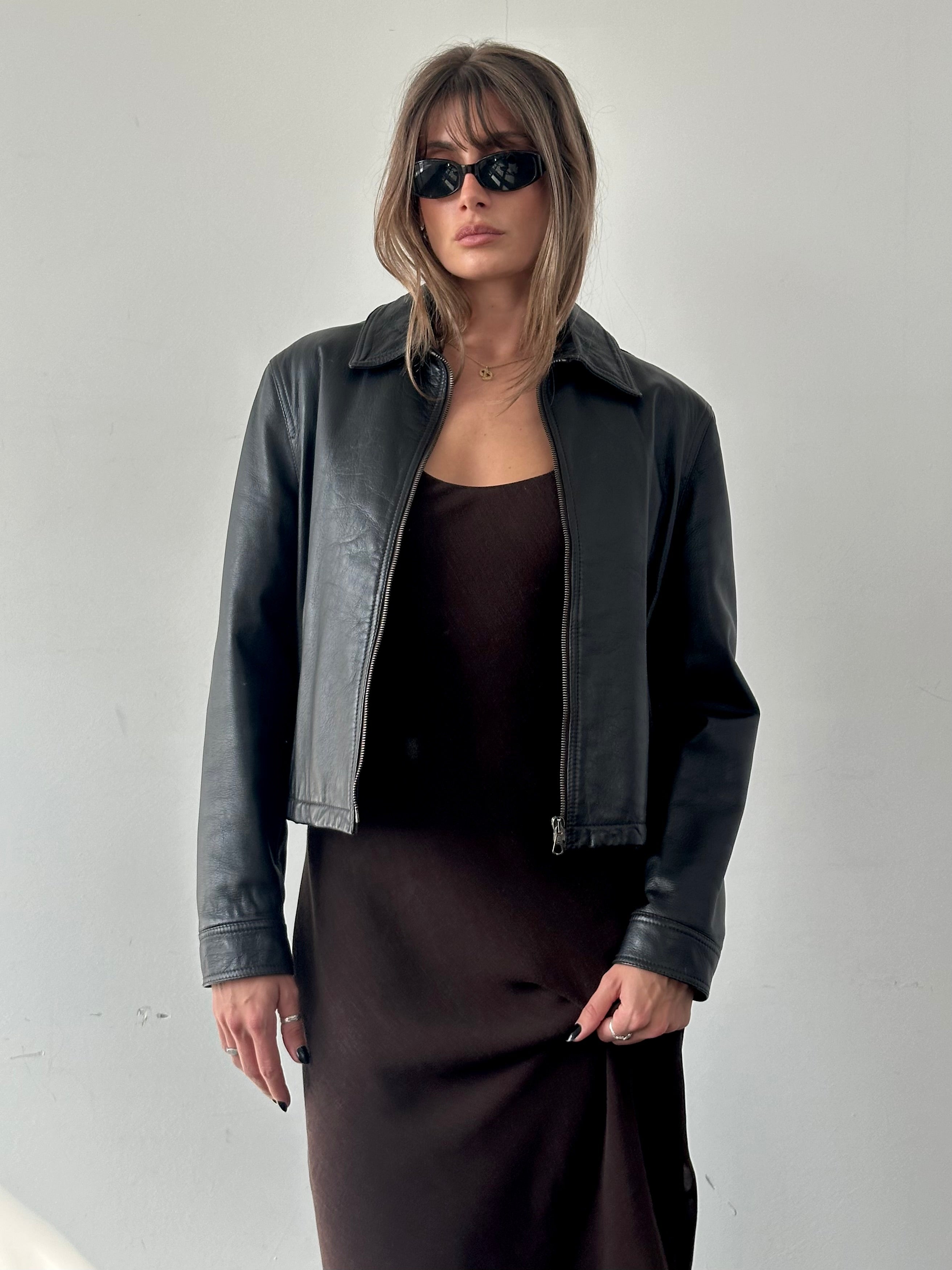Armani Jeans leather jacket in size S/M, stylish black leather with classic design and subtle branding details.