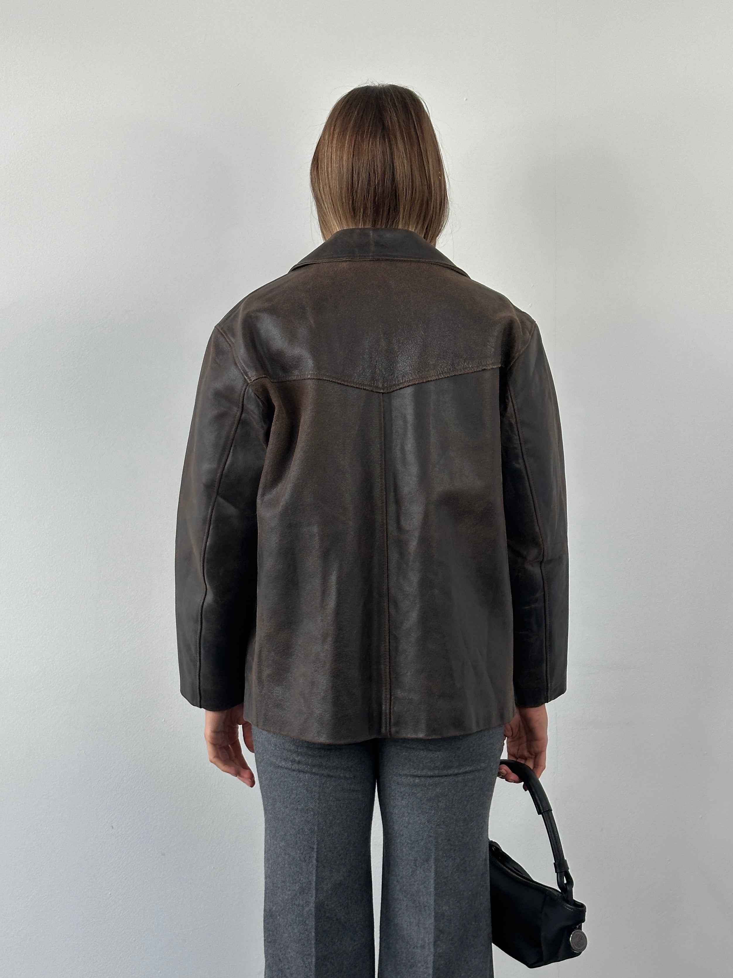 Conbipel 1970s Italian aged leather jacket in size M/L, showcasing vintage style with distressed brown leather and classic design.